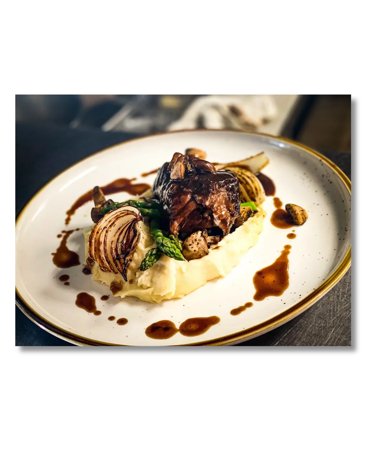 Slow-braised short ribs over housemade mashed potatoes with pearl onions and bordelaise sauce at Flights & Irons in San Clemente