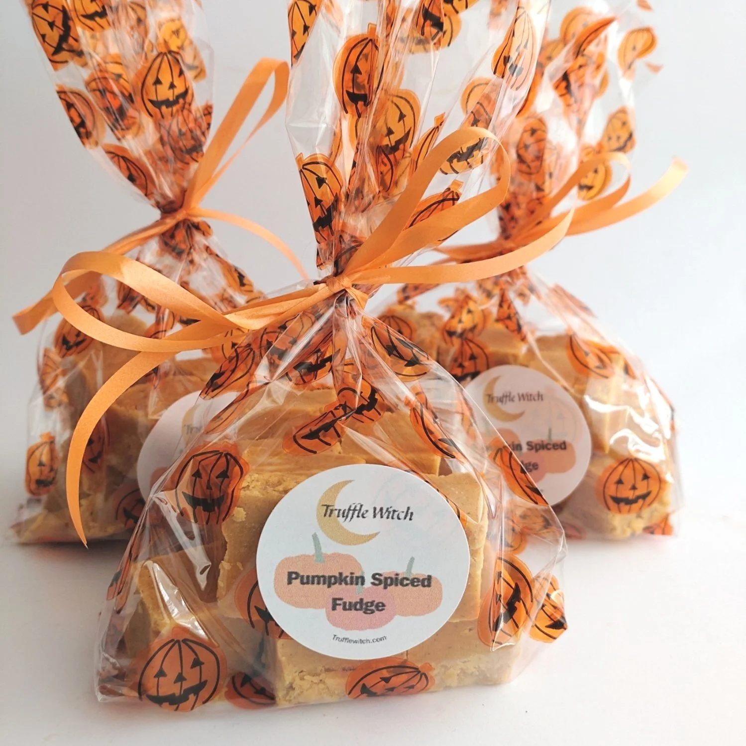 Bags of pumpkin spiced fudge on a white background