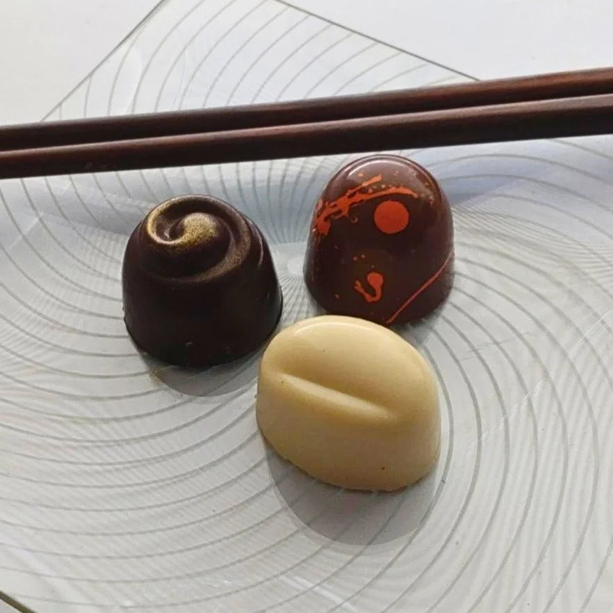 A trio from the Truffle Witch Japanese Chocolate Collection featuring yuzu, matcha and ginger, and miso caramel flavours.