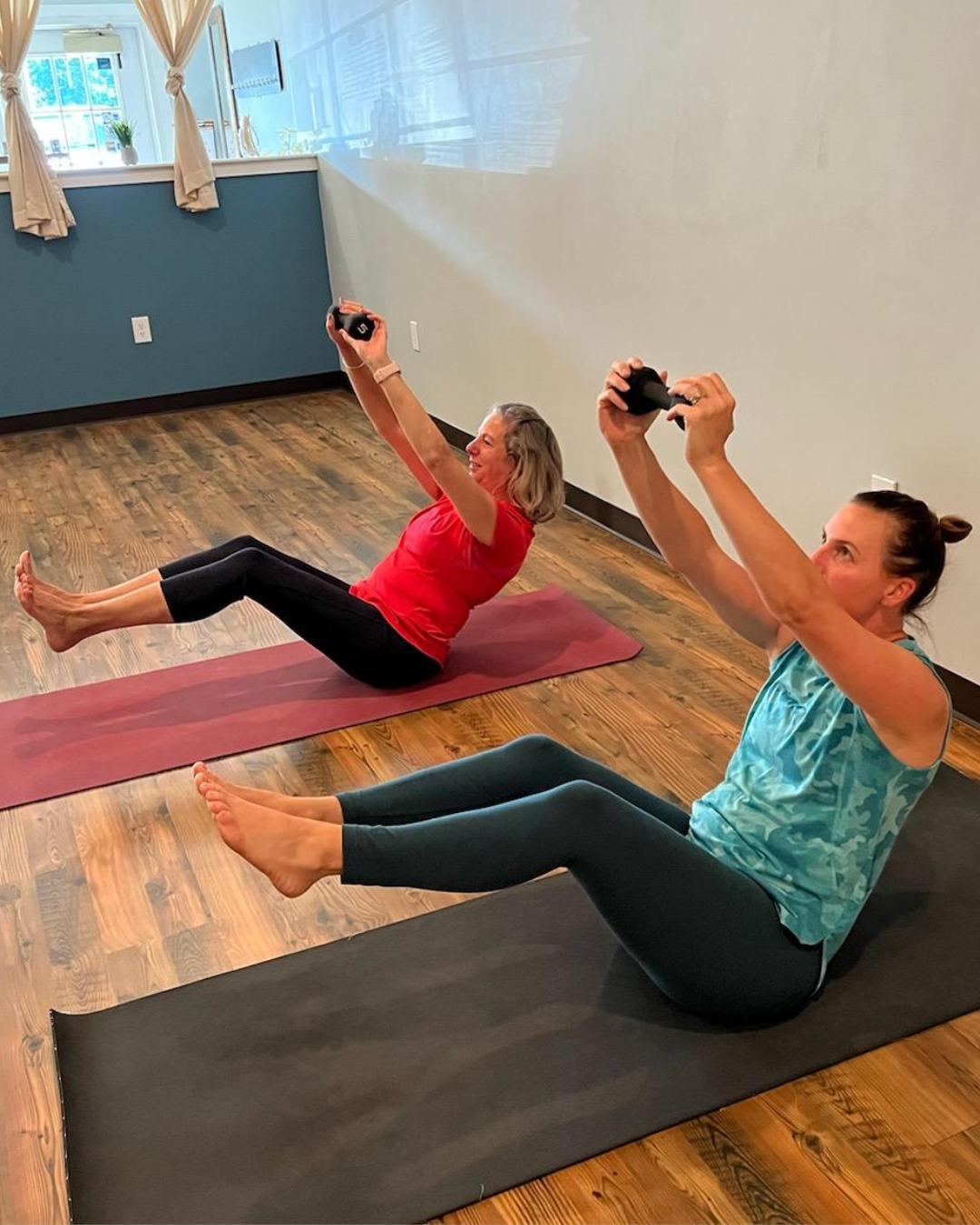 Private Lessons at Emerald Yoga Studio in Pembroke MA Two Women Doing Boat Pose