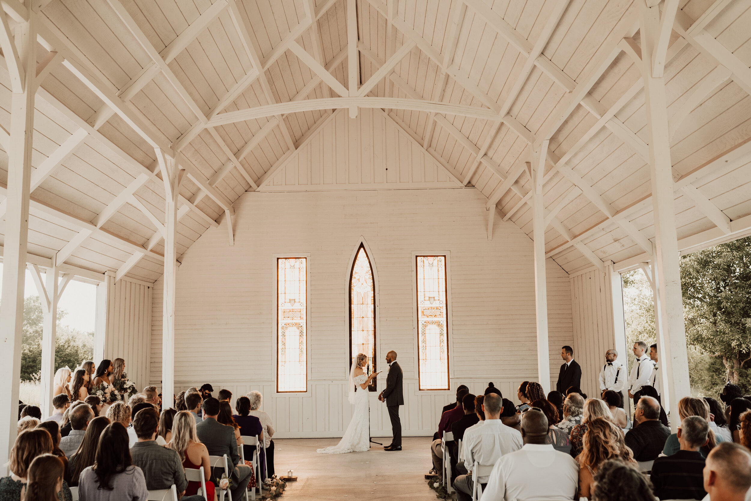 Hayley + Lorenzo - Summer White Chapel Wedding at Stone Hill Barn in Augusta, Kansas