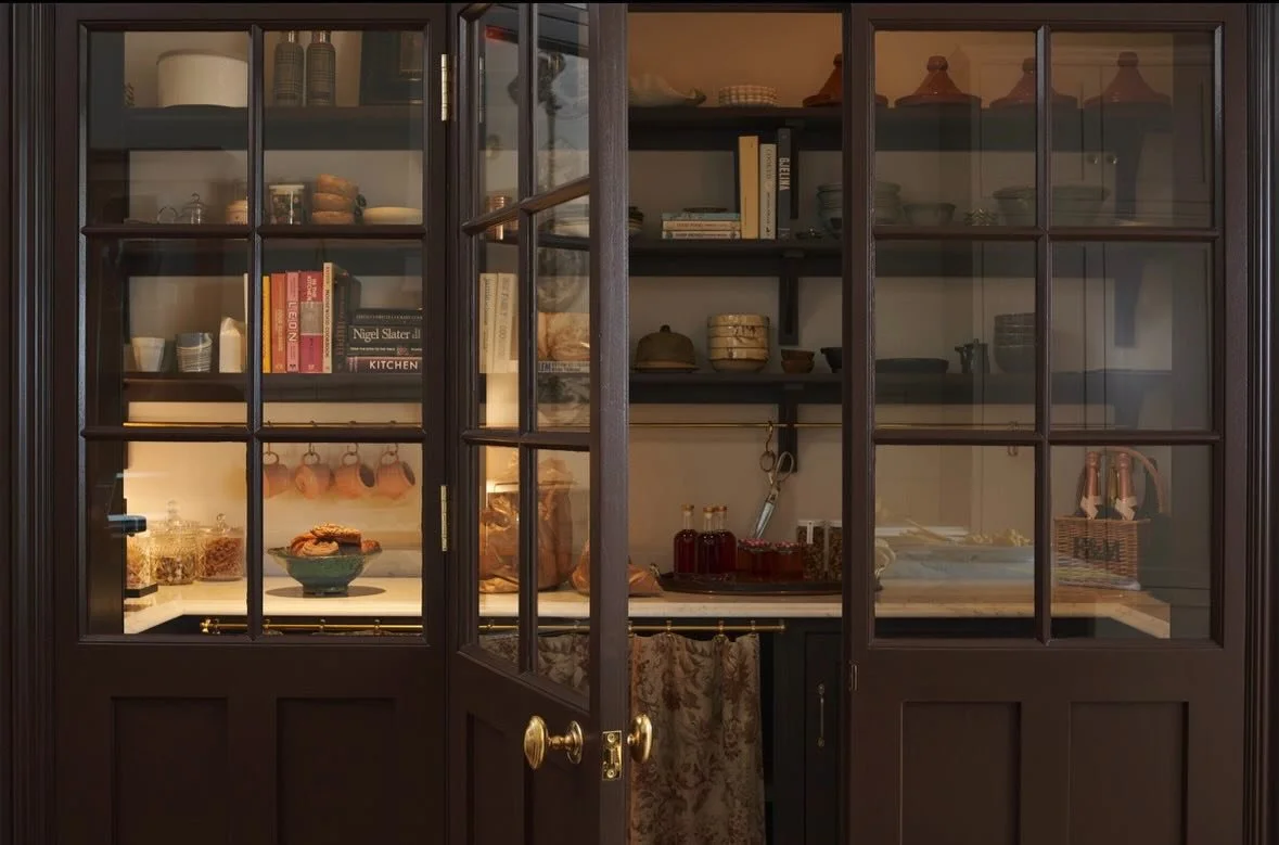 A chocolatey dream of a pantry in Mapesbury.

The glazed door and panels designed by @miltonarchitects and executed by @blockhousebuild and the joinery by @devolkitchens are both painted in Cola by @farrowandball and give this pantry just the comfort
