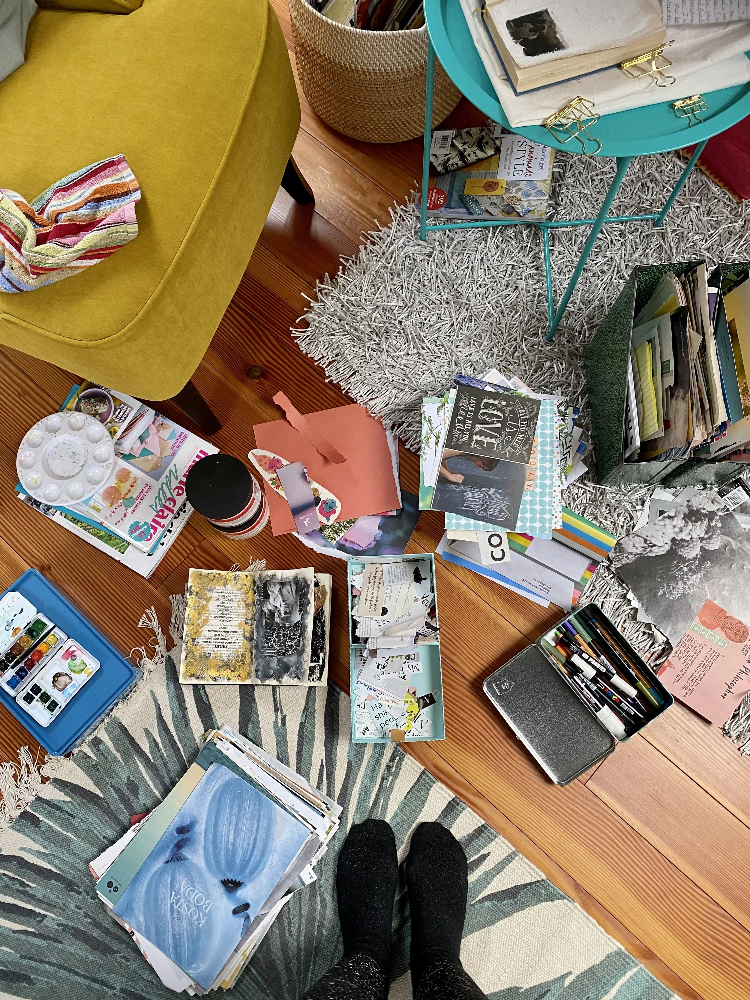 collage, papers on the floor, studio mess, magazines, looking down