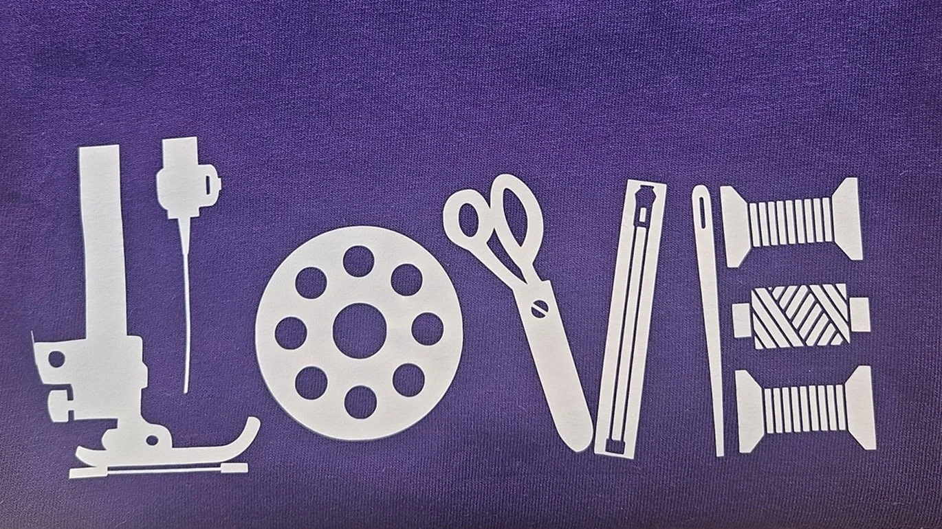 Purple sewing gift tee shirt — LOVE graphic with scissors thread and pins