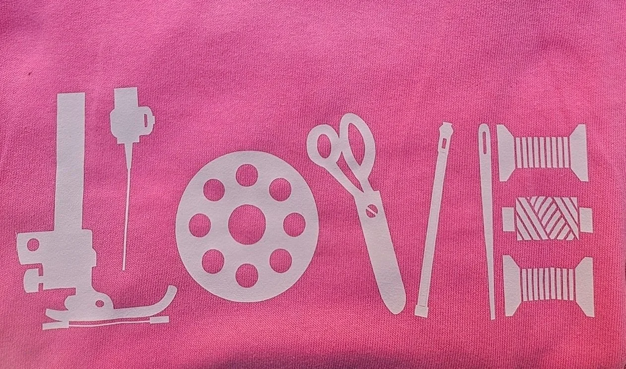 Pink quilter gift tee shirt — LOVE spelled in scissors thread and pins