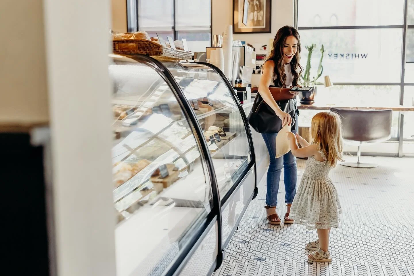 This is ME. Phone in one hand, computer falling out of bag, handing my chocolate-obsessed child a cookie in the other hand, and processing that I had just found out a day before that I was pregnant. 

Fast forward to today, my little boy Eli is 11-we