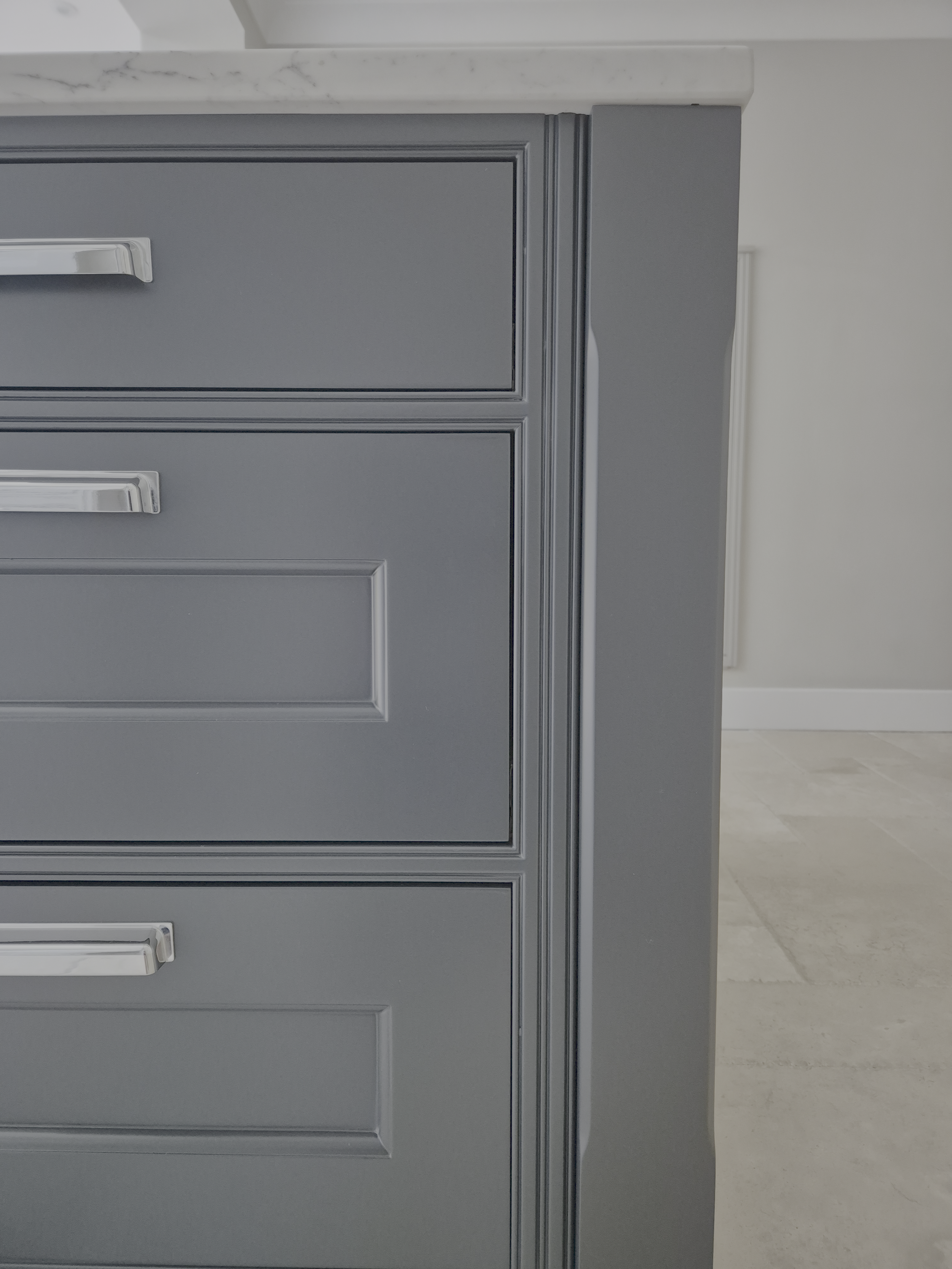 Dark shaker kitchen cabinets with chrome handles