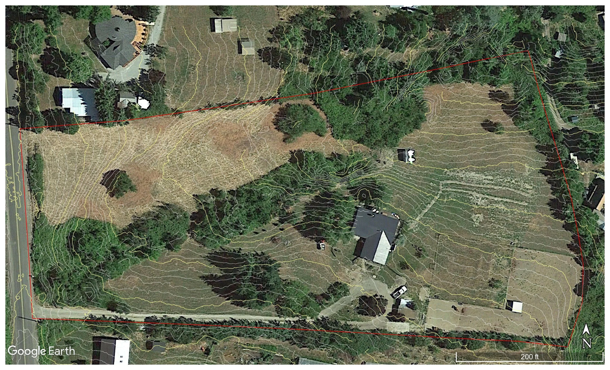 Aerial view of a homestead property with topographic contour lines, trees, and buildings, showing property boundaries marked in red. The terrain is varied with clearings and vegetation, and the North direction is indicated.