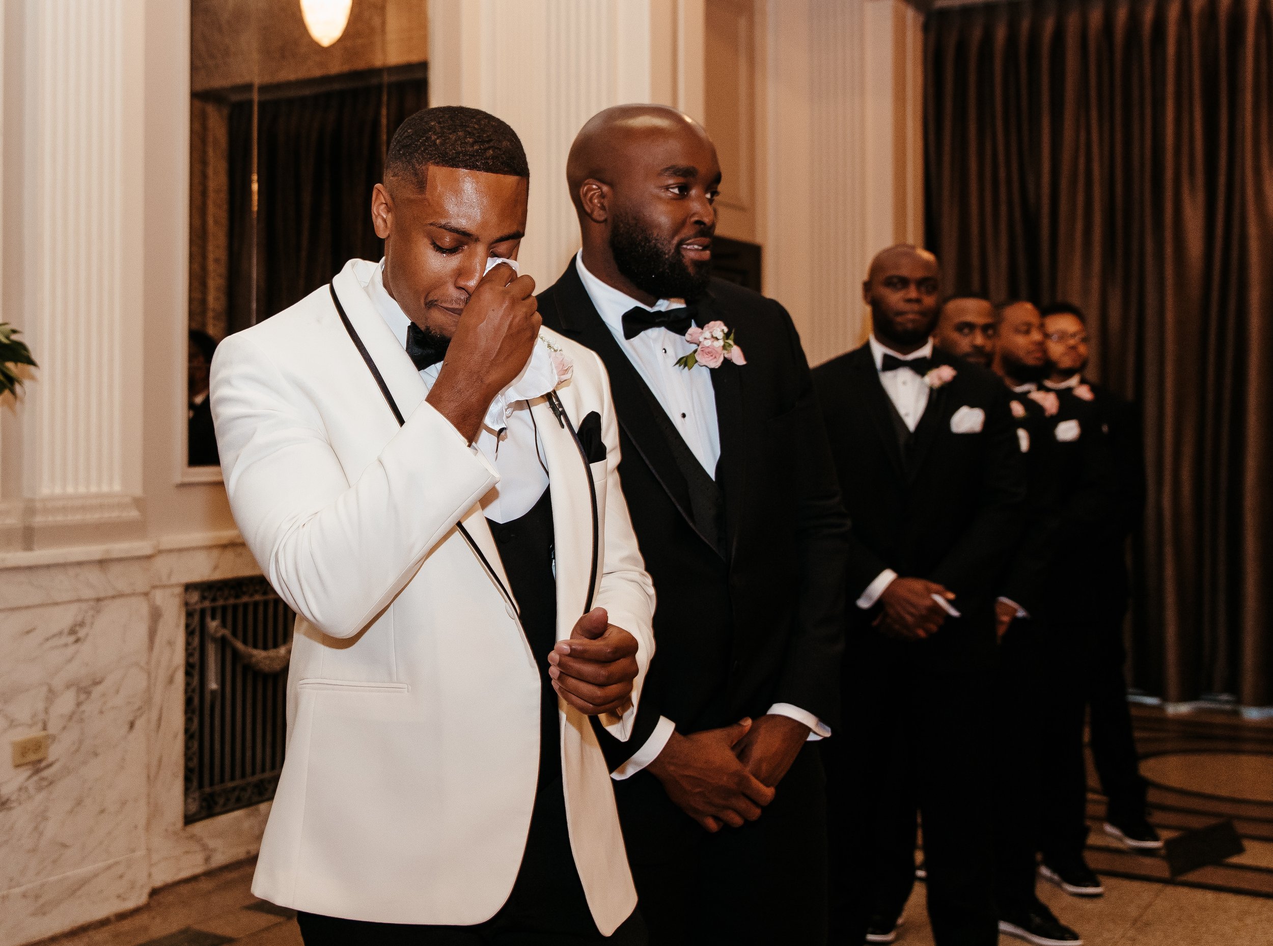 Groom in White Suit