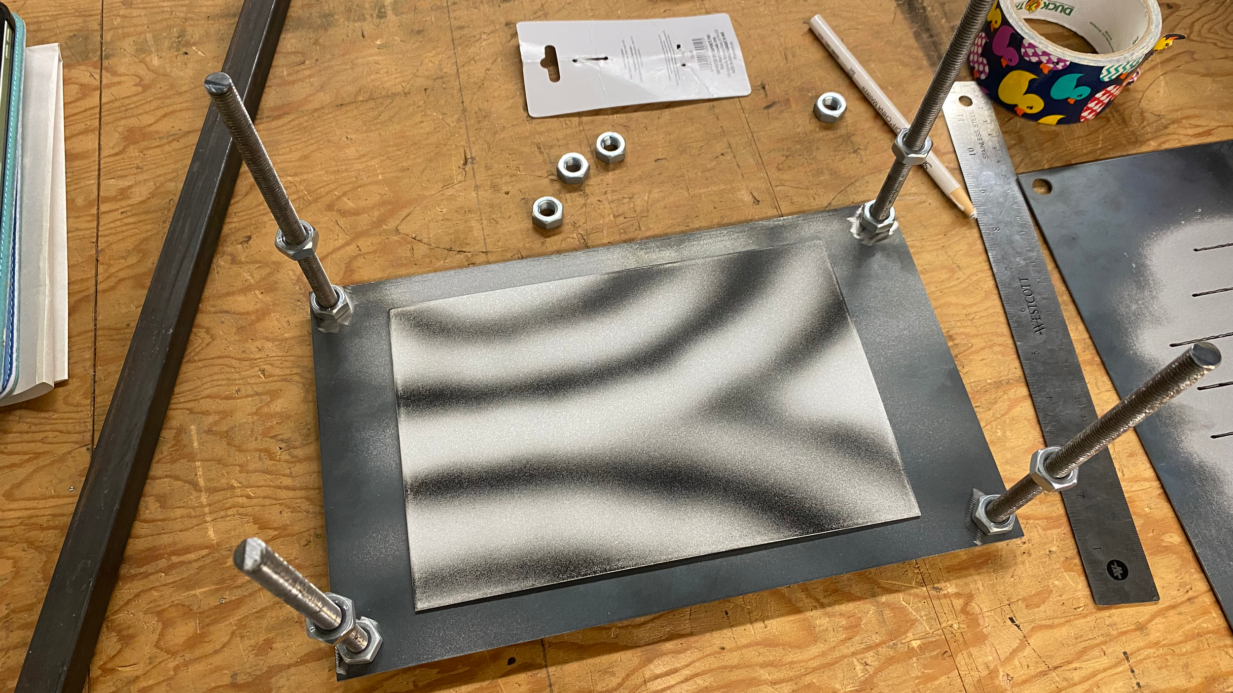 The Double-slit Experiment, Revisited. Ground and blasted plate sitting in the blasting jig, ready to be etched
