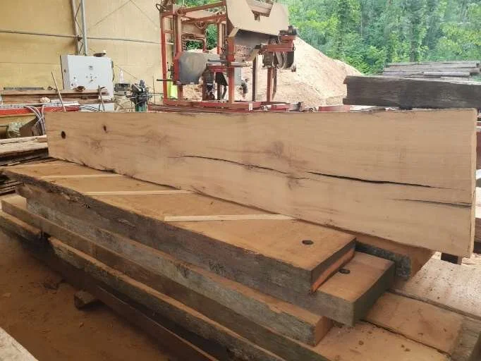 Reclaimed Oak Winepress Beam cut into wide slabs for joinery.