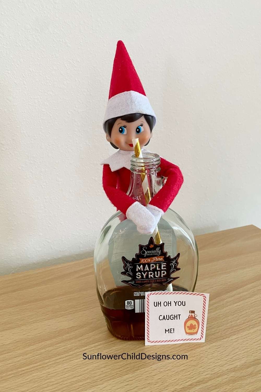 Elf on the Shelf drinking maple syrup