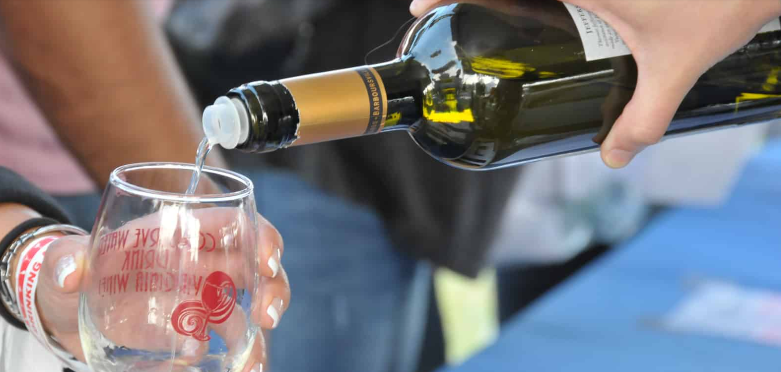 People sample wine from Starburn Winery at the United Bank Bloomin' Wine  Festival on Friday April 28, 2017 in Winchester, Va.. The wine festival,  which continues on Saturday, officially kicked-off the start