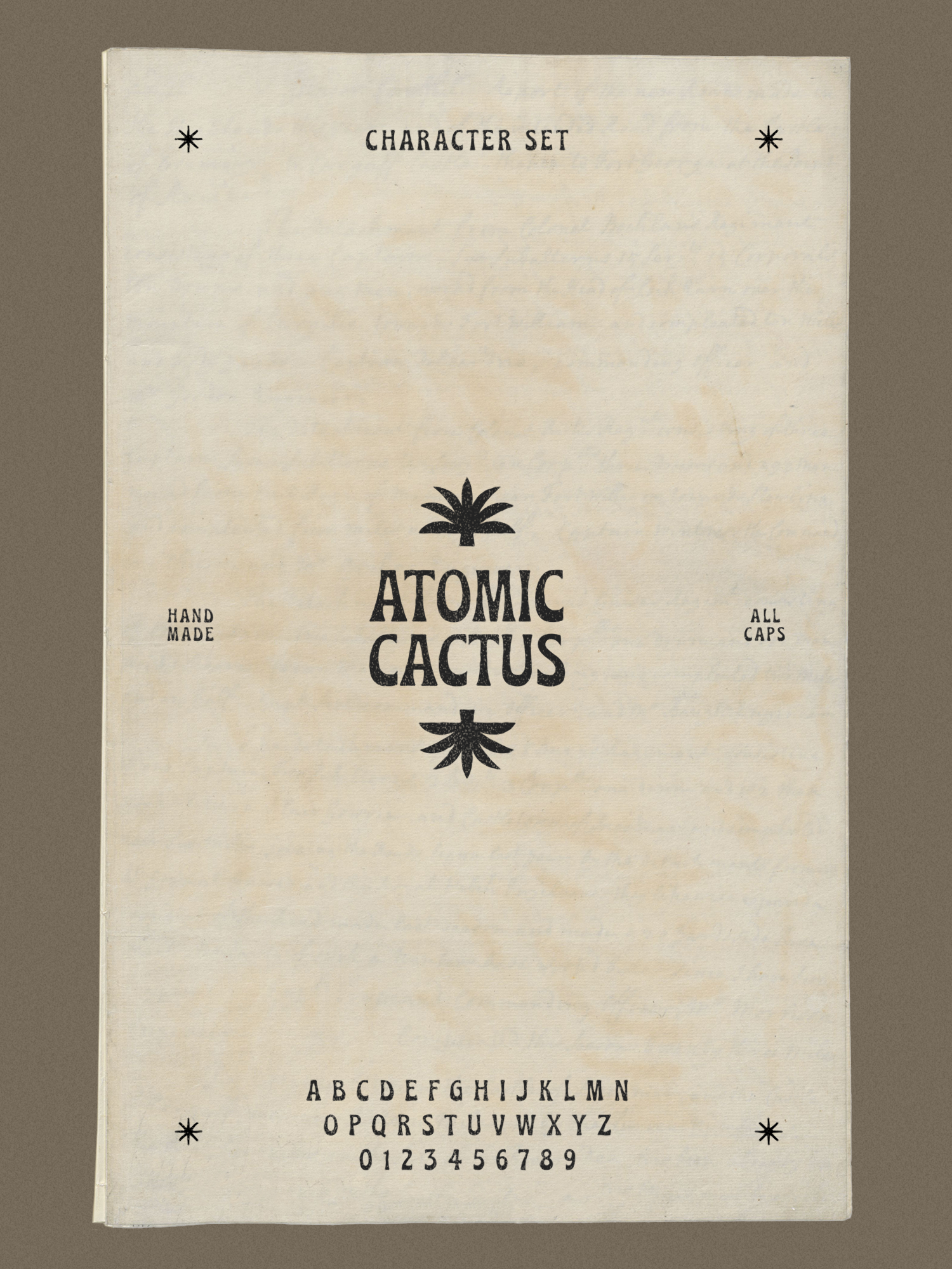 A vintage-style packet labeled "Atomic Cactus" with a graphic of a cactus at the top and bottom, and the text "Character Set," "Hand Made," "All Caps" with alphabet and numbers at the bottom.