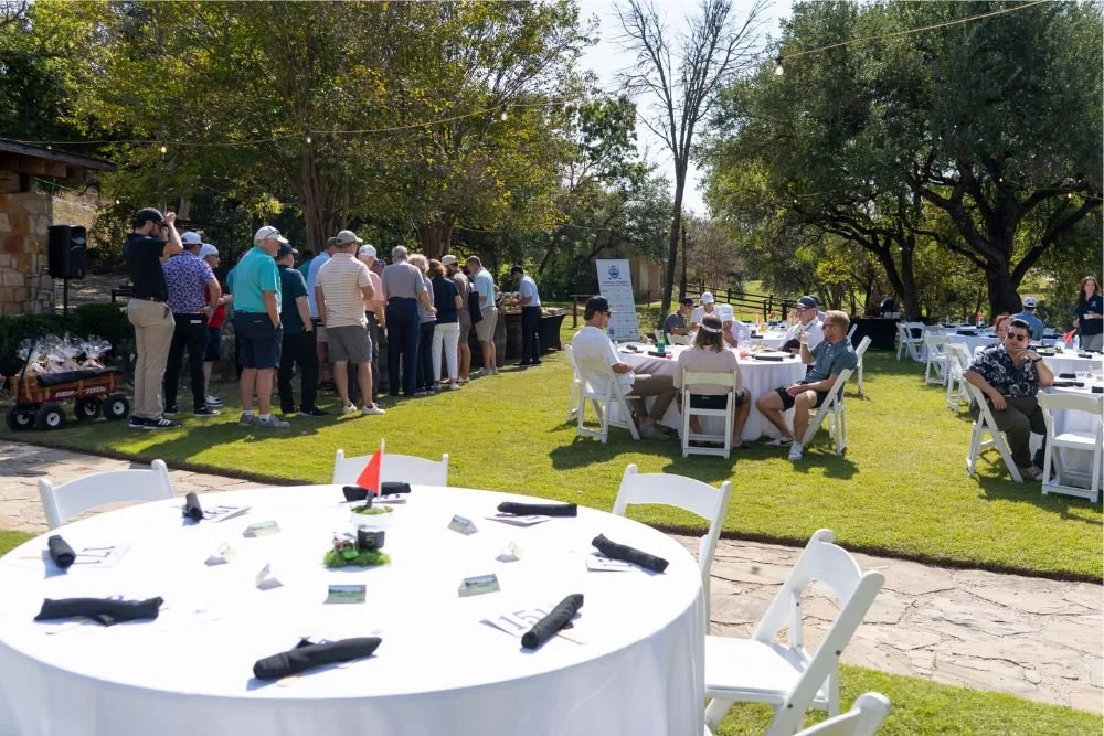 Golf lunch outside with golf themed centerpiece on the table