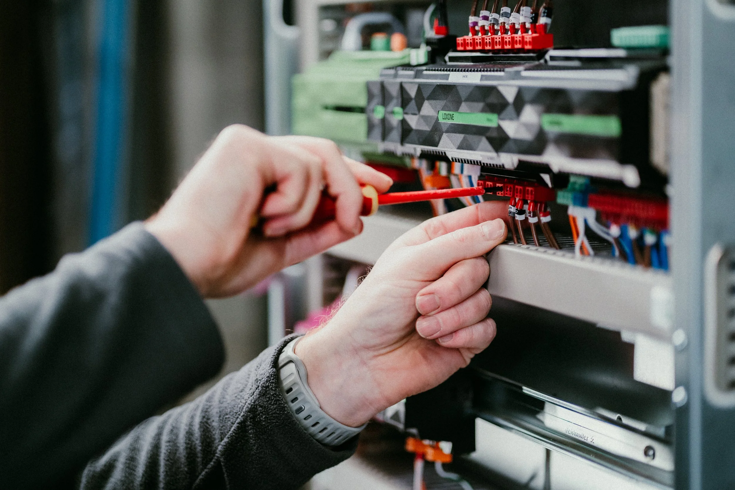 A technician wiring smart technology