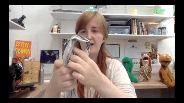 gif of several people making and manipulating paper puppets