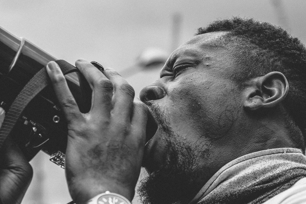 A photographer working with a camera
