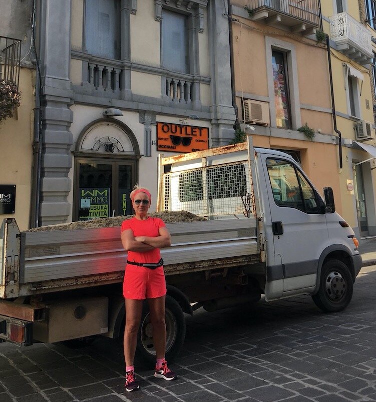 Anita and truck in front of Palazzo Florio 