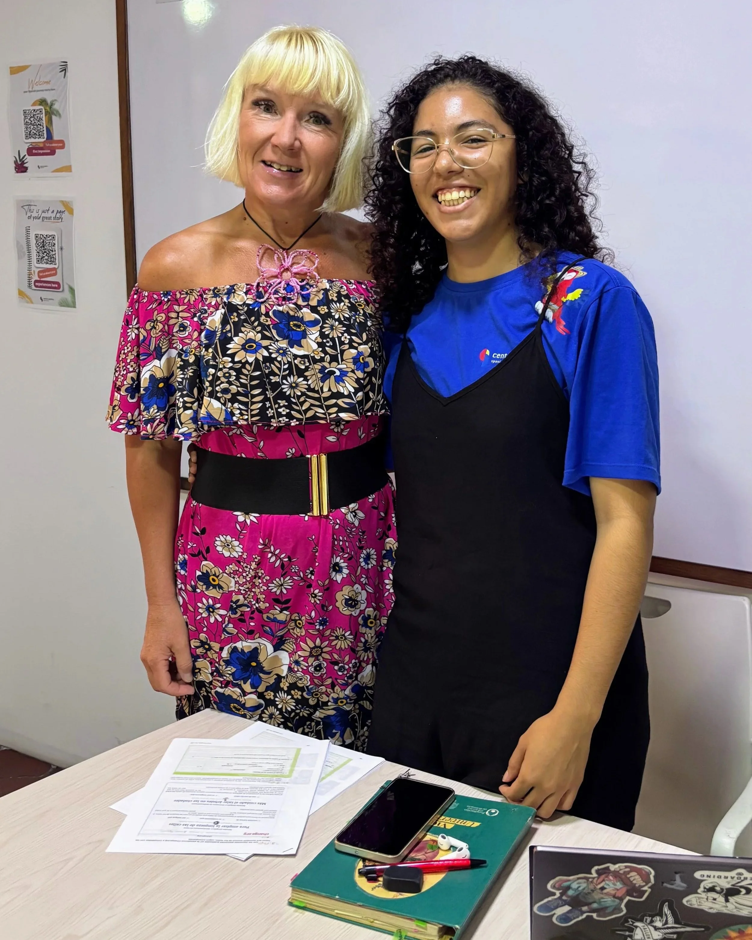 Anita and prof Celeste standing in front of whiteboard in classroom