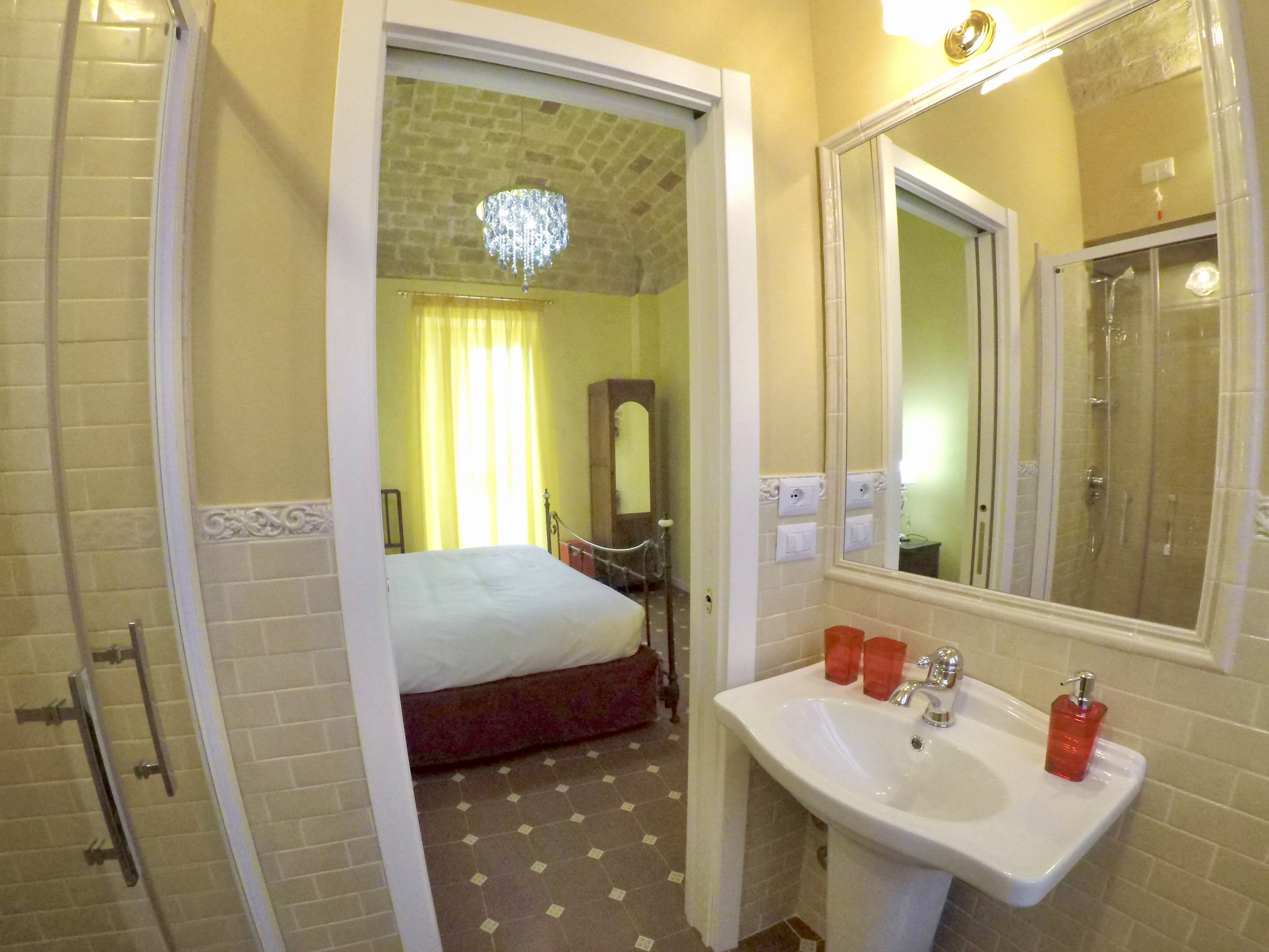 View from the bathroom into Queen Room with Balcony