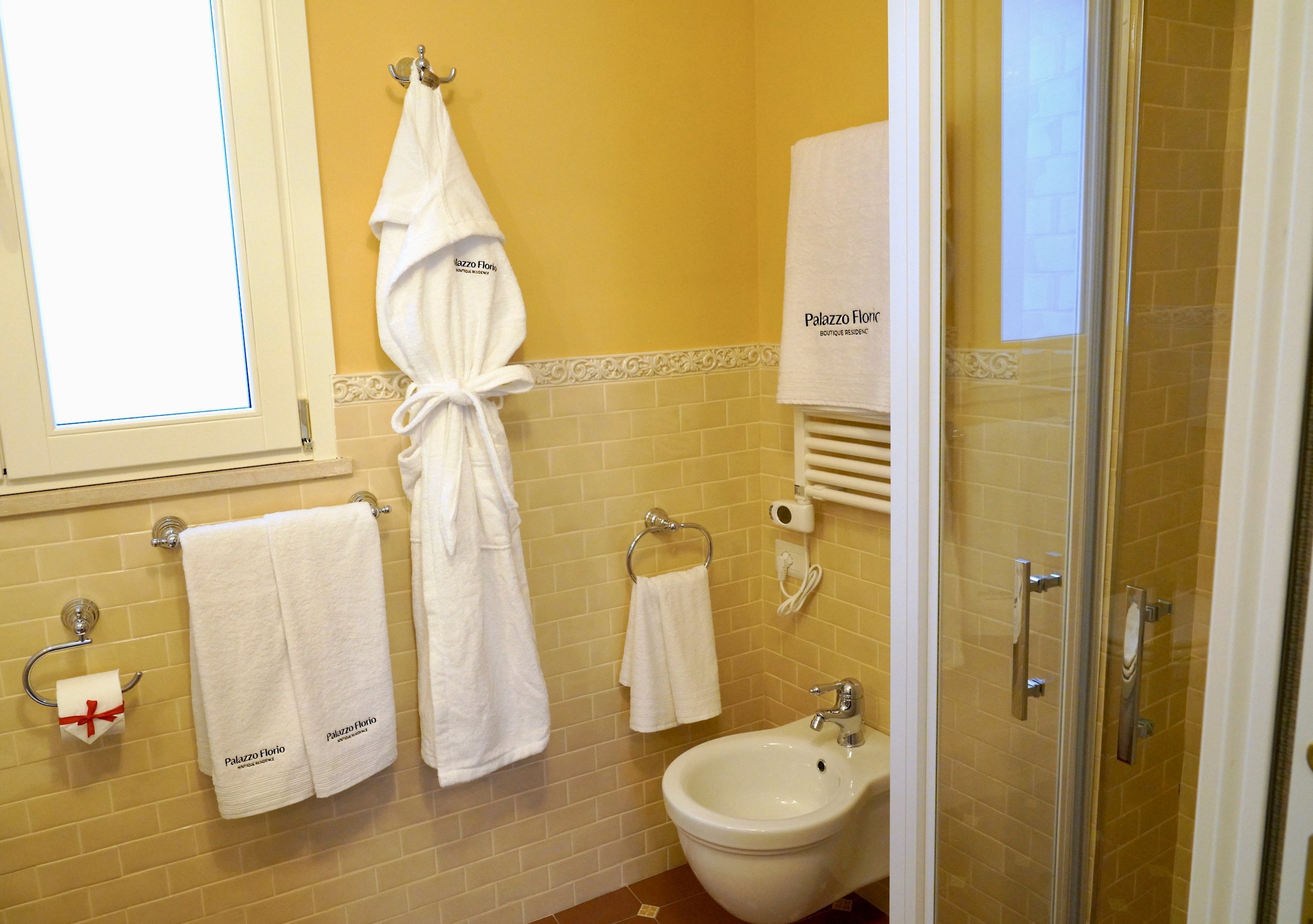 Shower area and embroidered towels