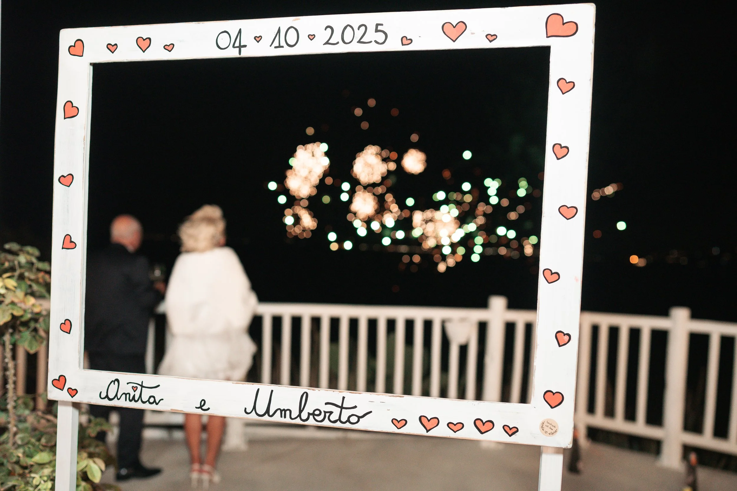 anita and umberto watching fireworks at their wedding