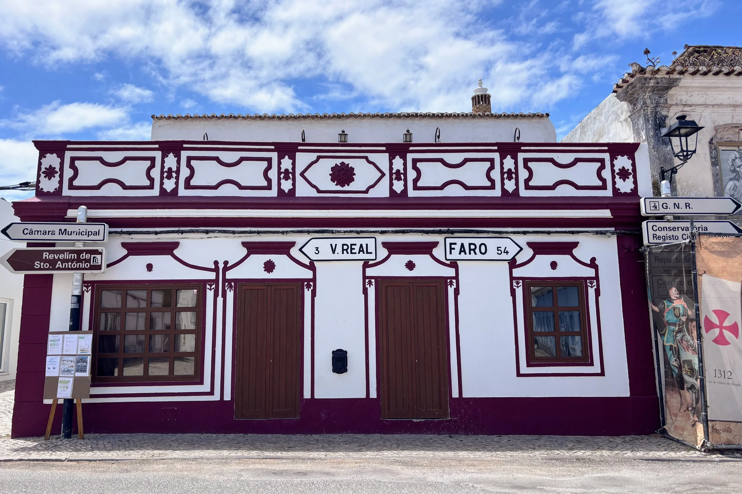 traditional Portuguese townhouse in the center of Castro Marim, the Algarve, with signposting to the nearby towns