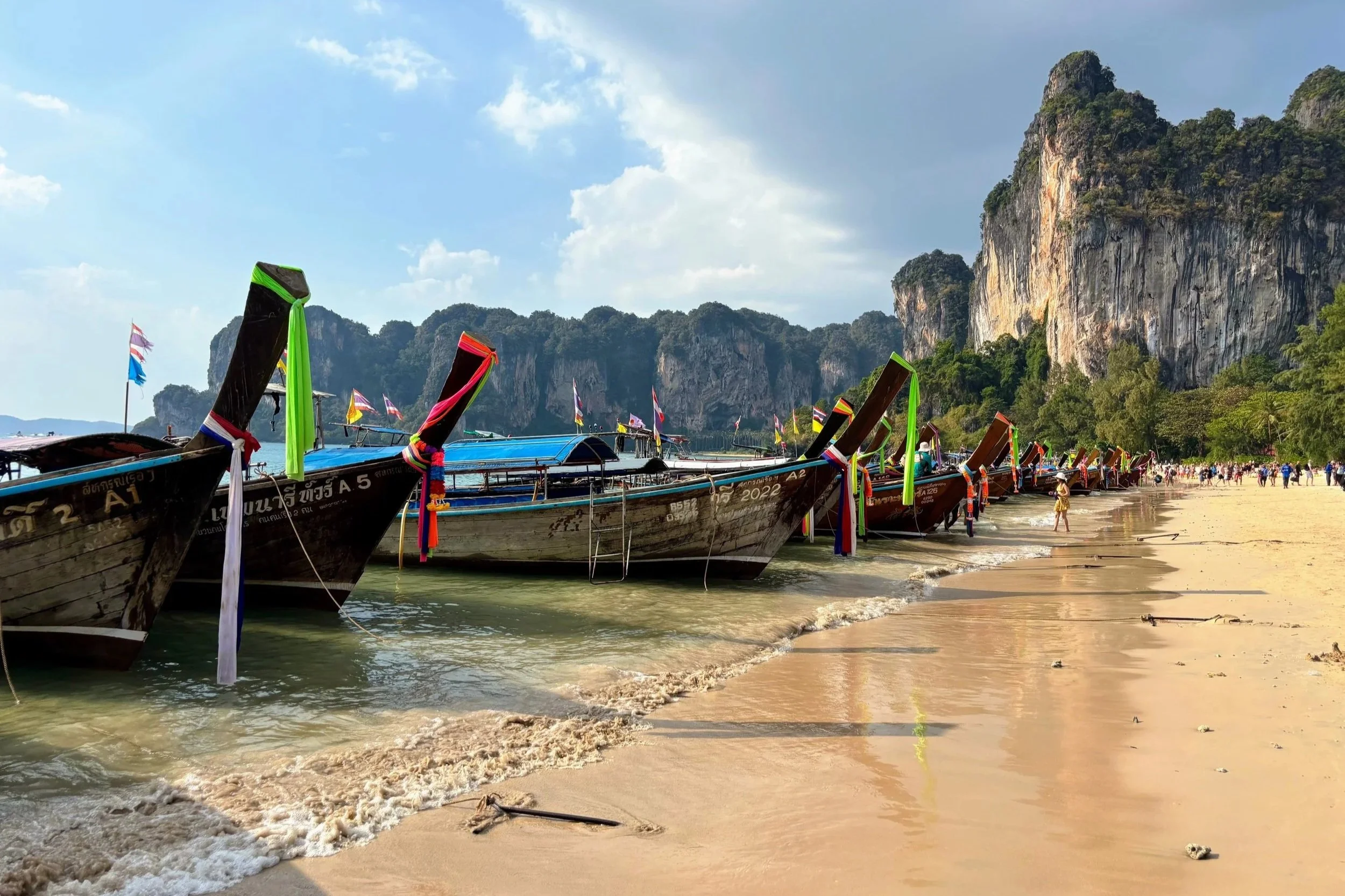 Boats in water on Railay beach in Ao Nang Thailand