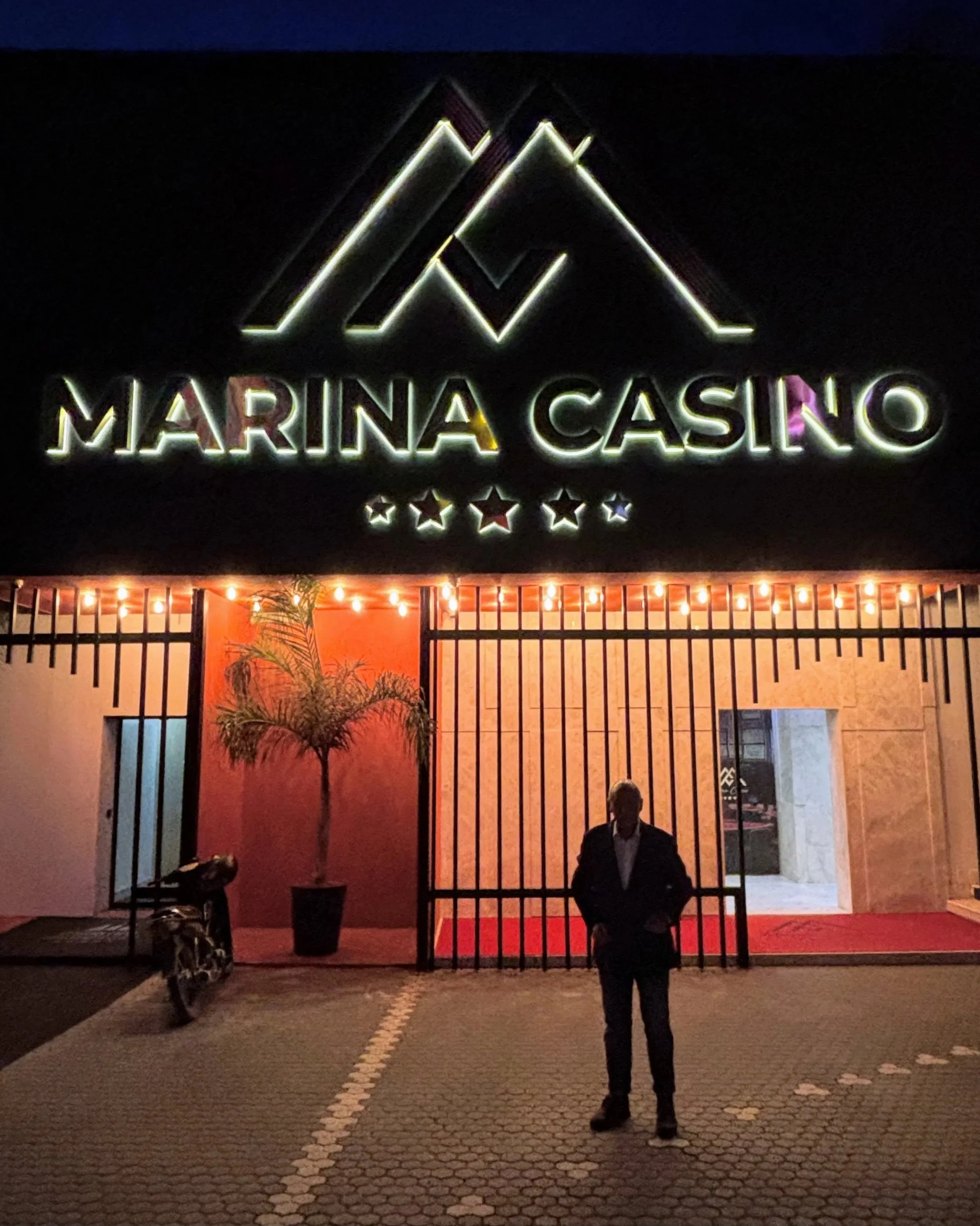 Umberto in front of the Marina Bay casino entrance in Vlore, Albania
