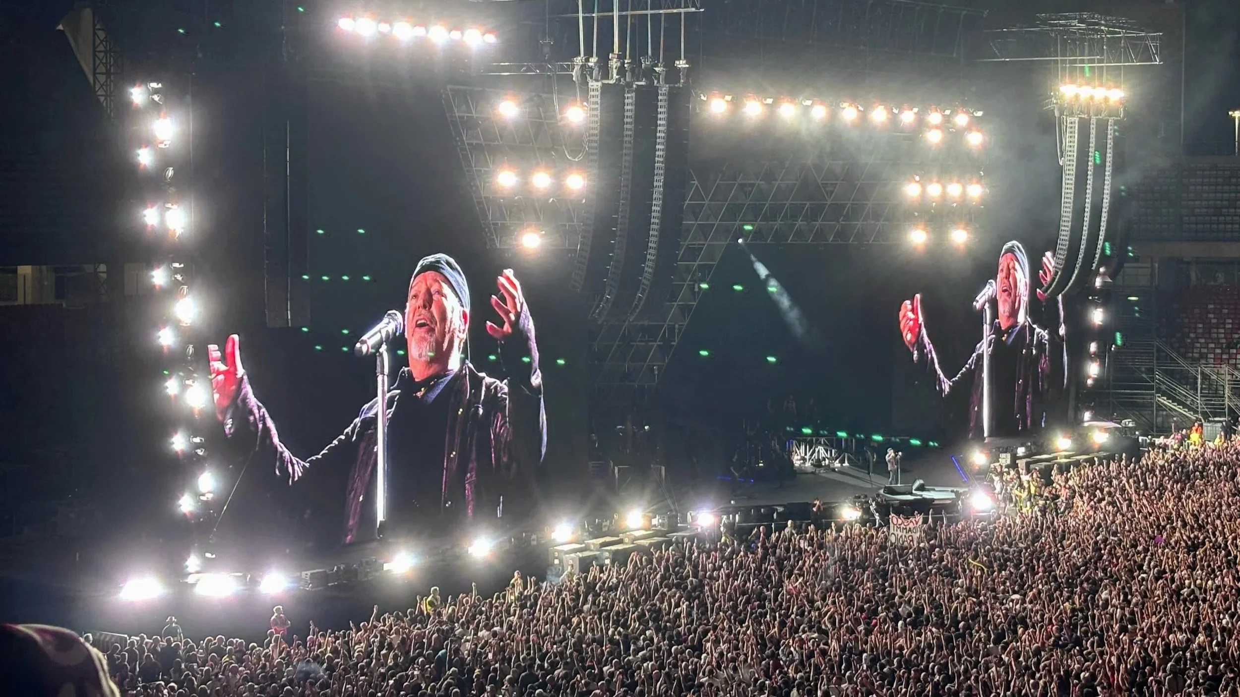 Vasco Rossi on the stage and enlarged image shown on two big screens at the San Nicola stadium in Bari