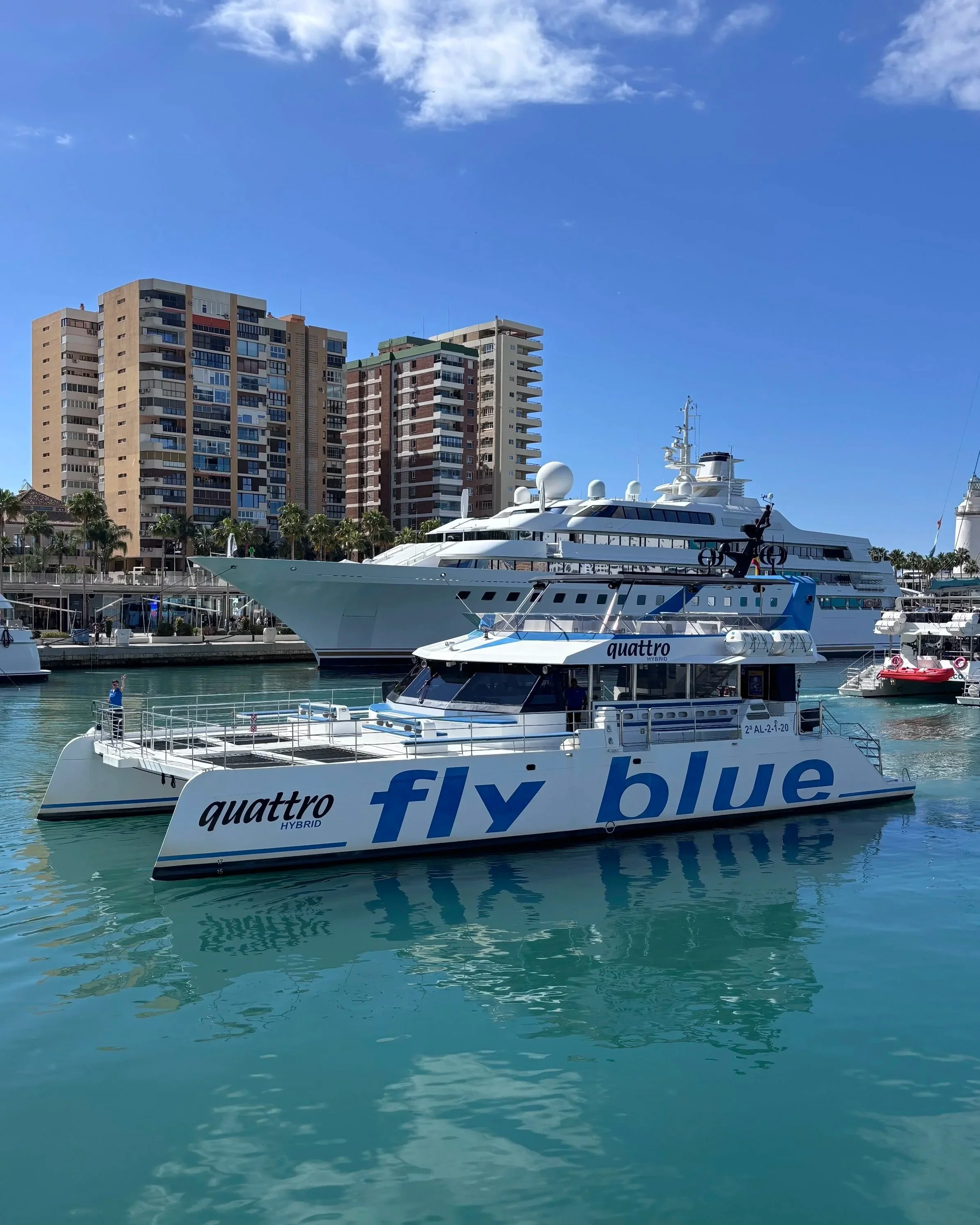 Fly Blue catamaran in Malaga harbor