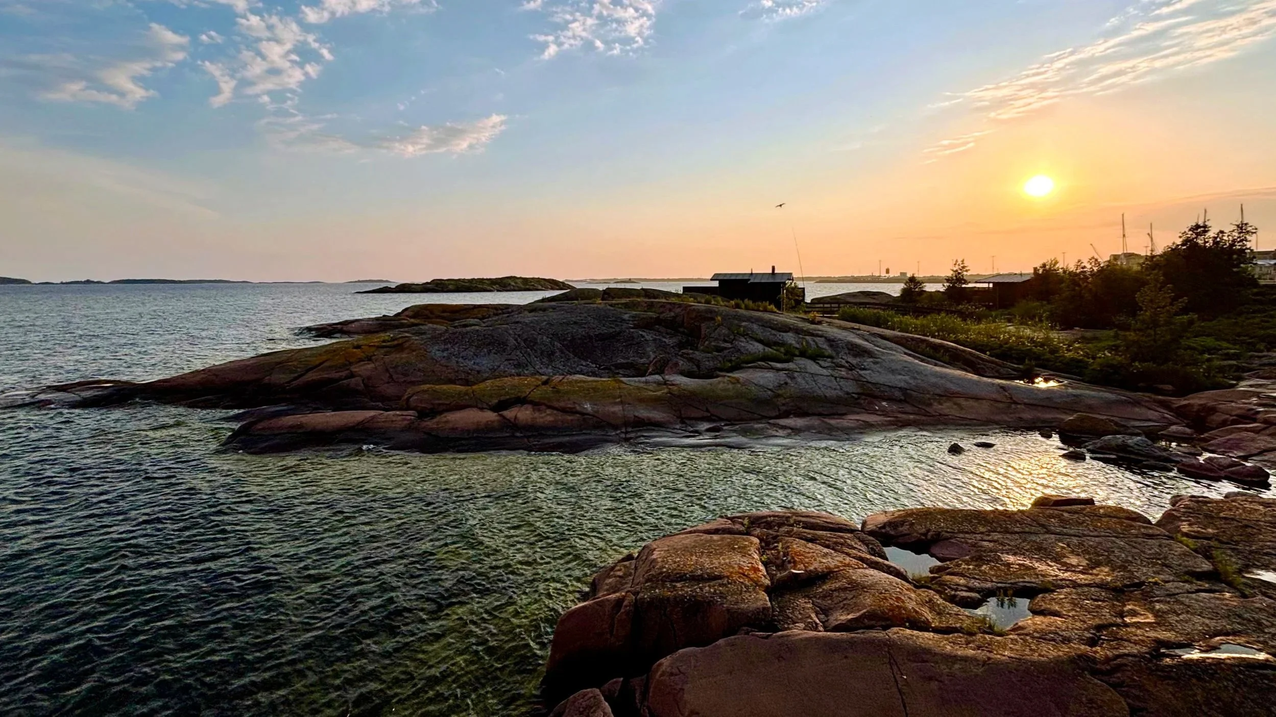 Sunset over the Baltic Sea and granite rocks in Hanko, Finland