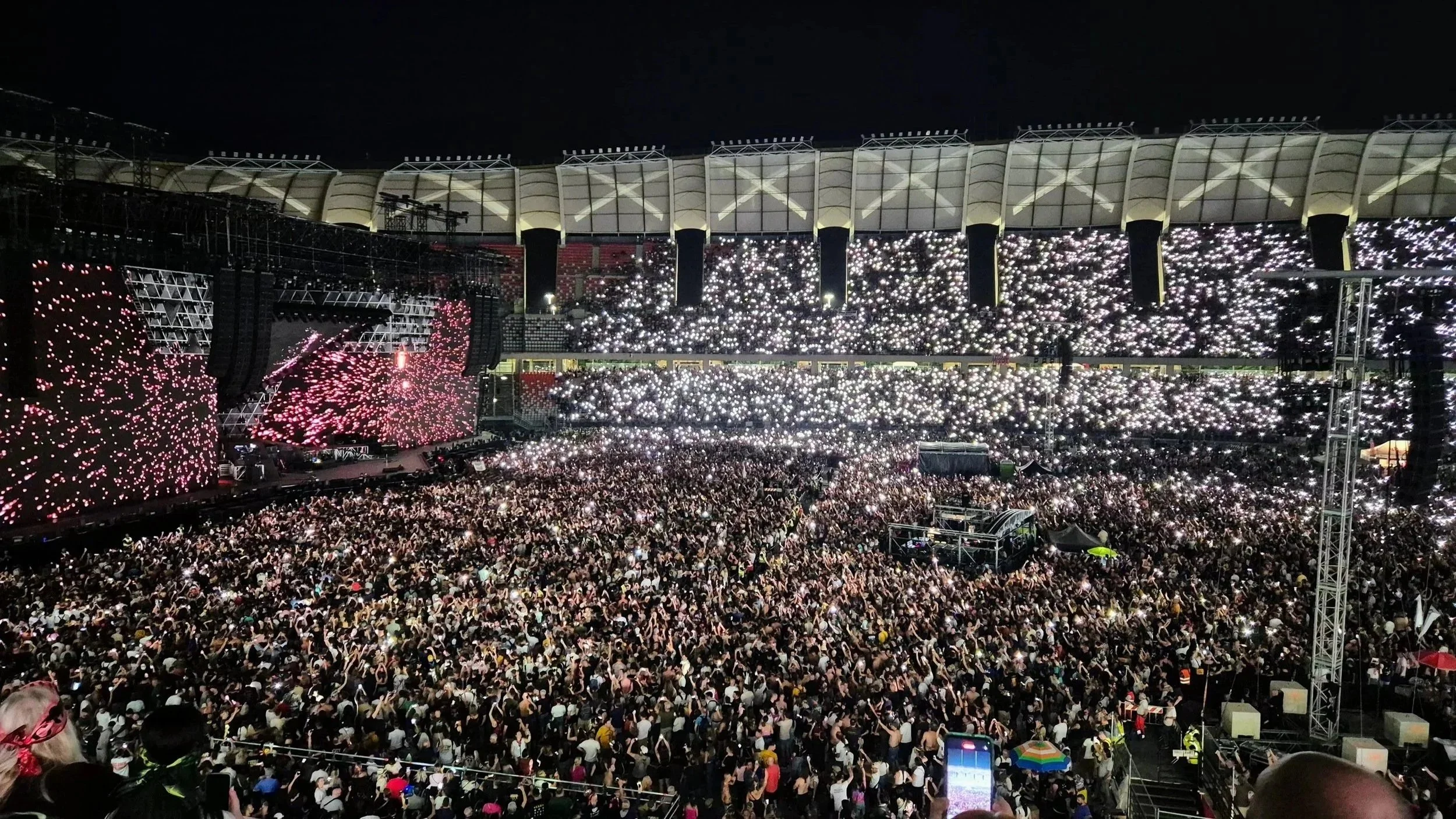 A crowd of 50,000 Vasco Rossi fans at the stadium of San Nicola in Bari, illuminating the stadium with cell phone lights switched on