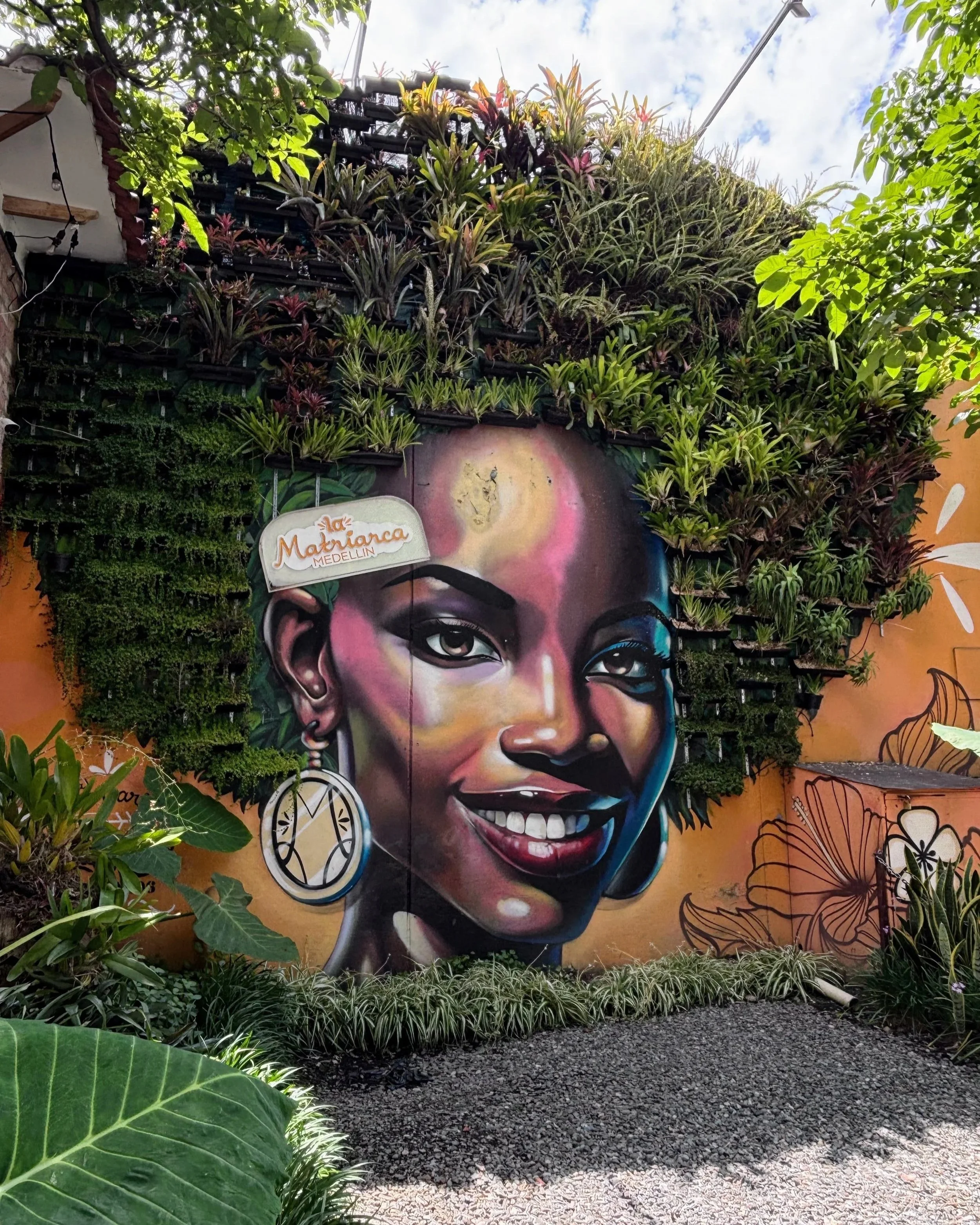 Street art in El Poblado, Medellin, featuring a young black woman