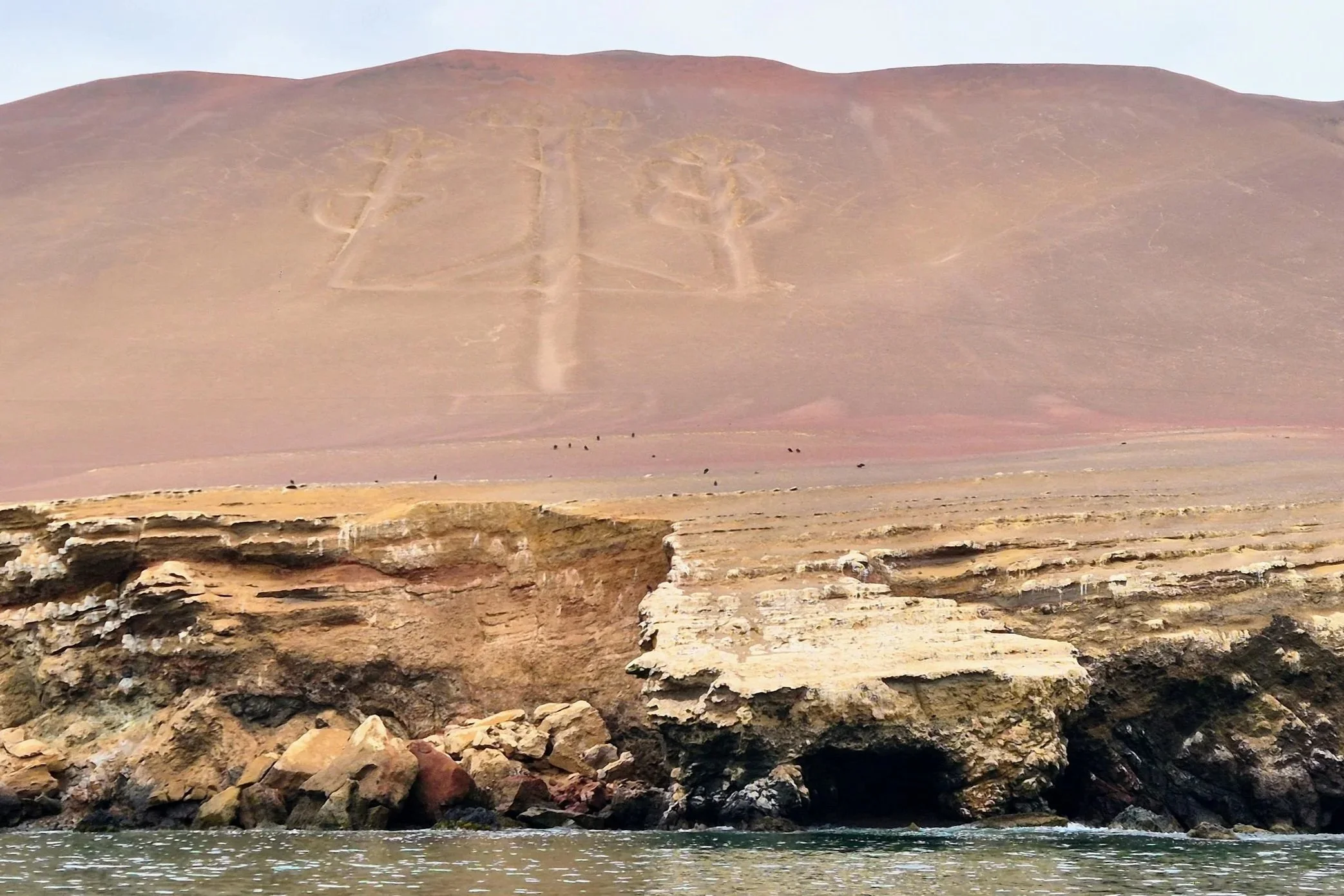 El Candelabro geoglyph on the hillside in the natural reserve of Paracas in Peru