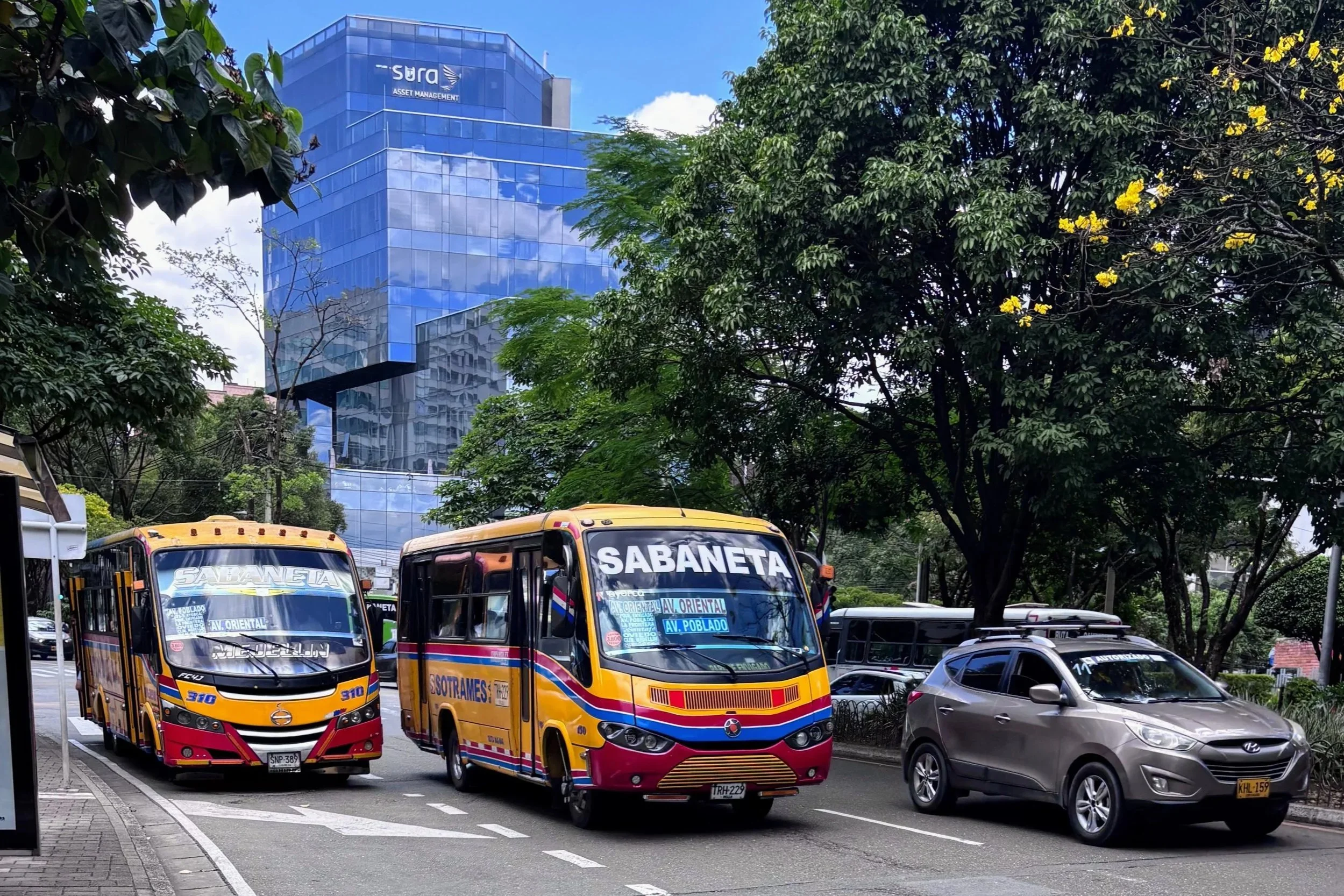 Two Sabaneta buses on a street in El Poblado, Medellin, Colombia