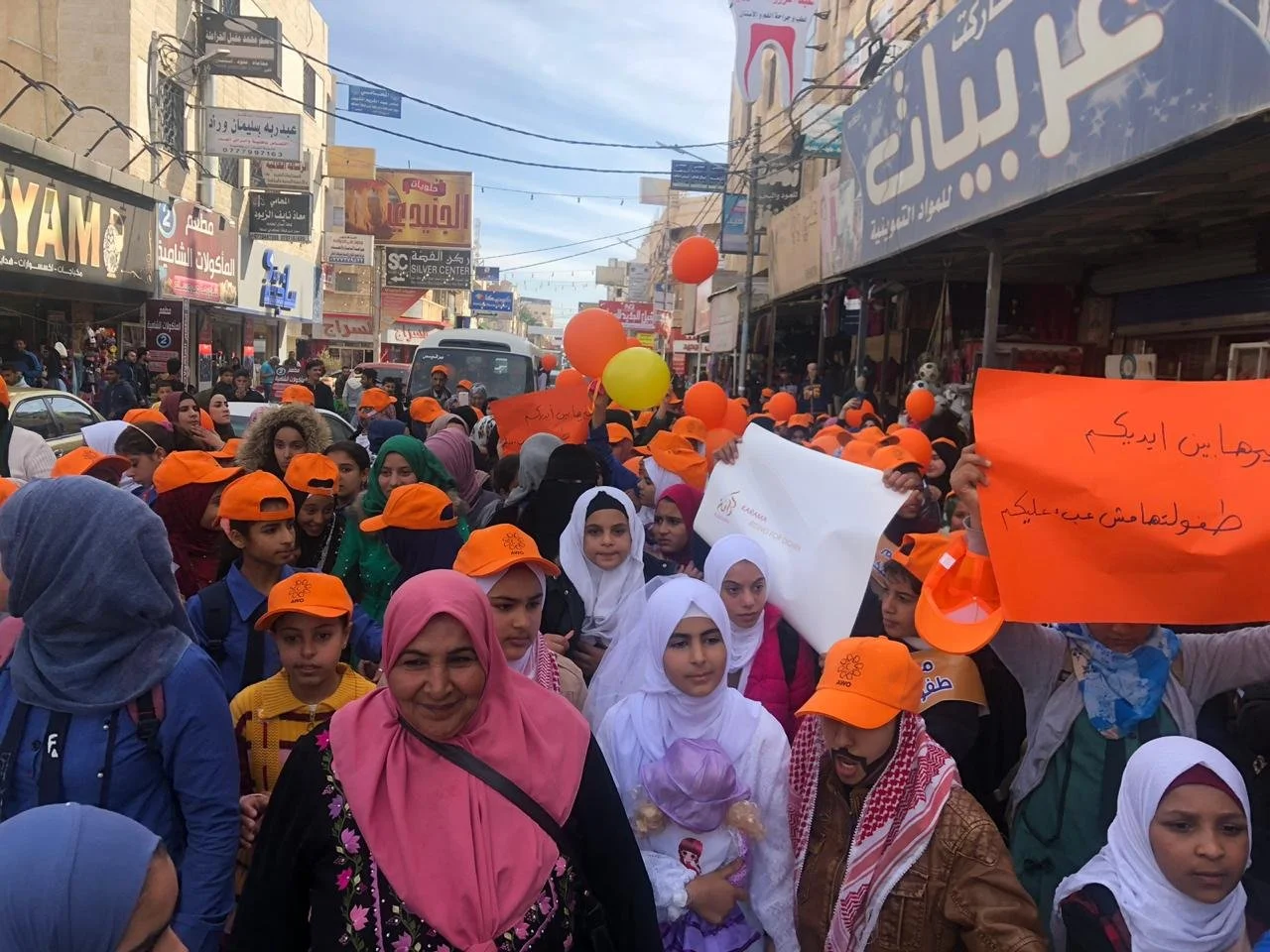 A group of young people lead a street demonstration against child marriage