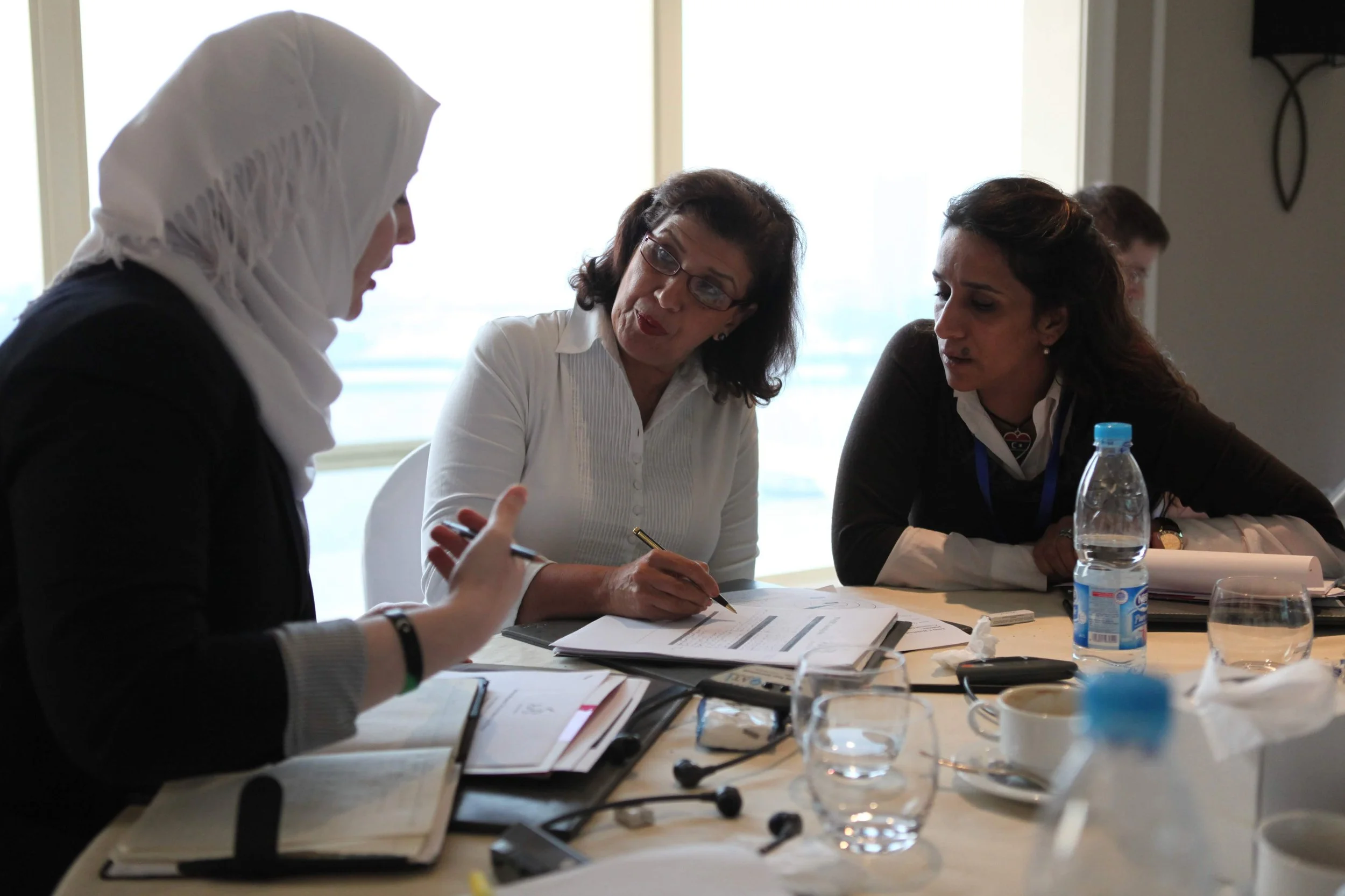 A group of three women talking
