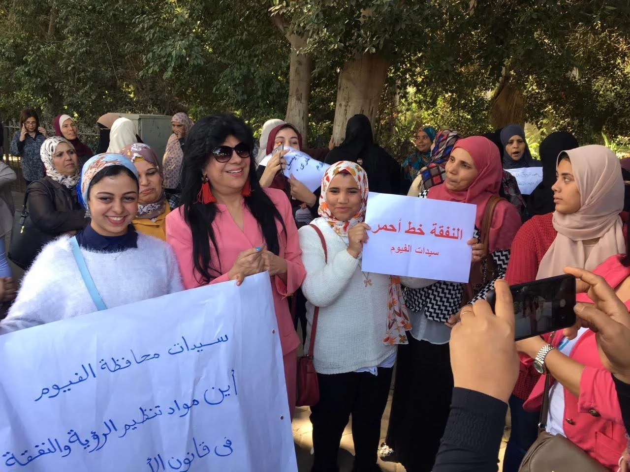 A group of women hold placards during a demonstration