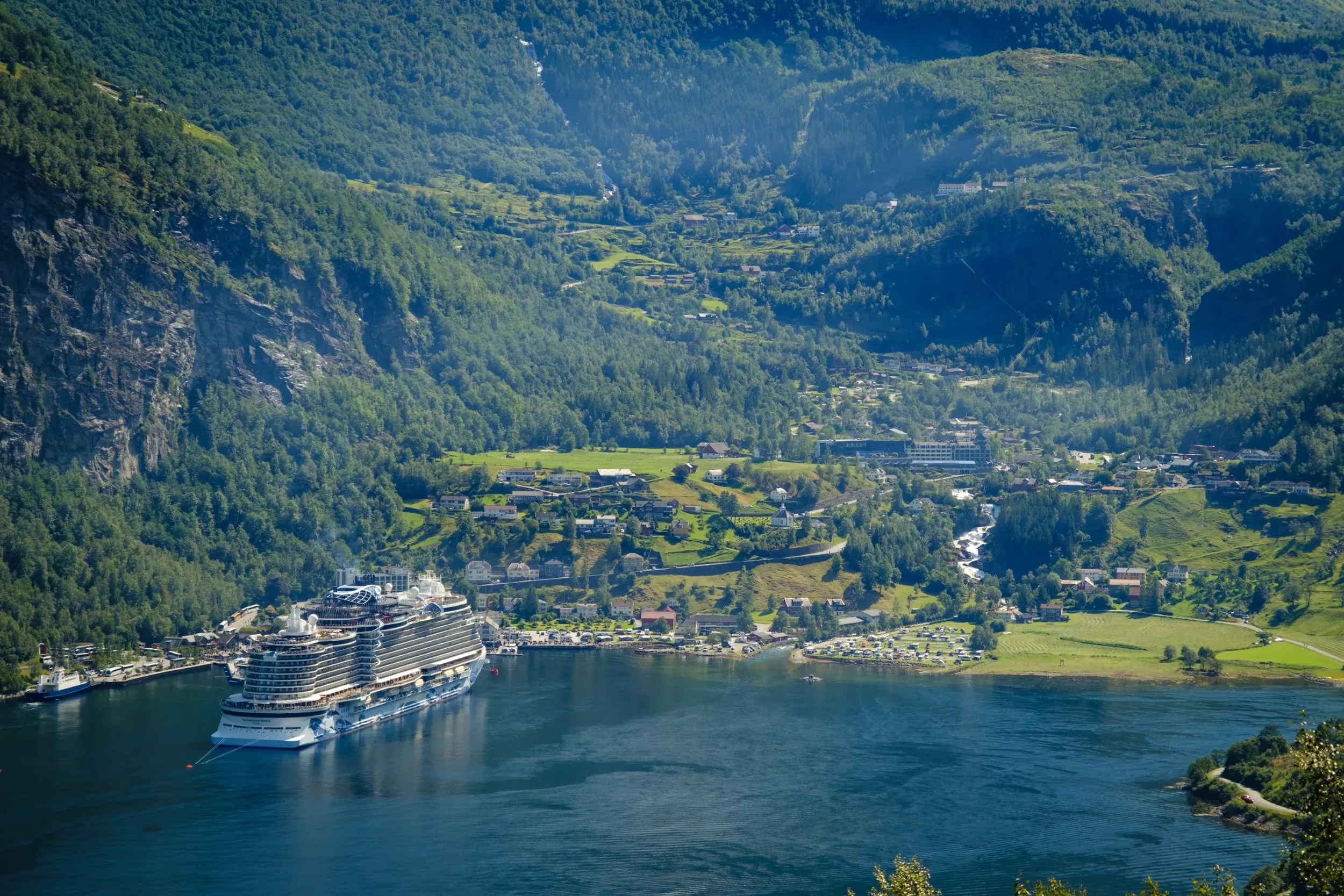 Geiranger on a sunny day with cruiseship on the fjord