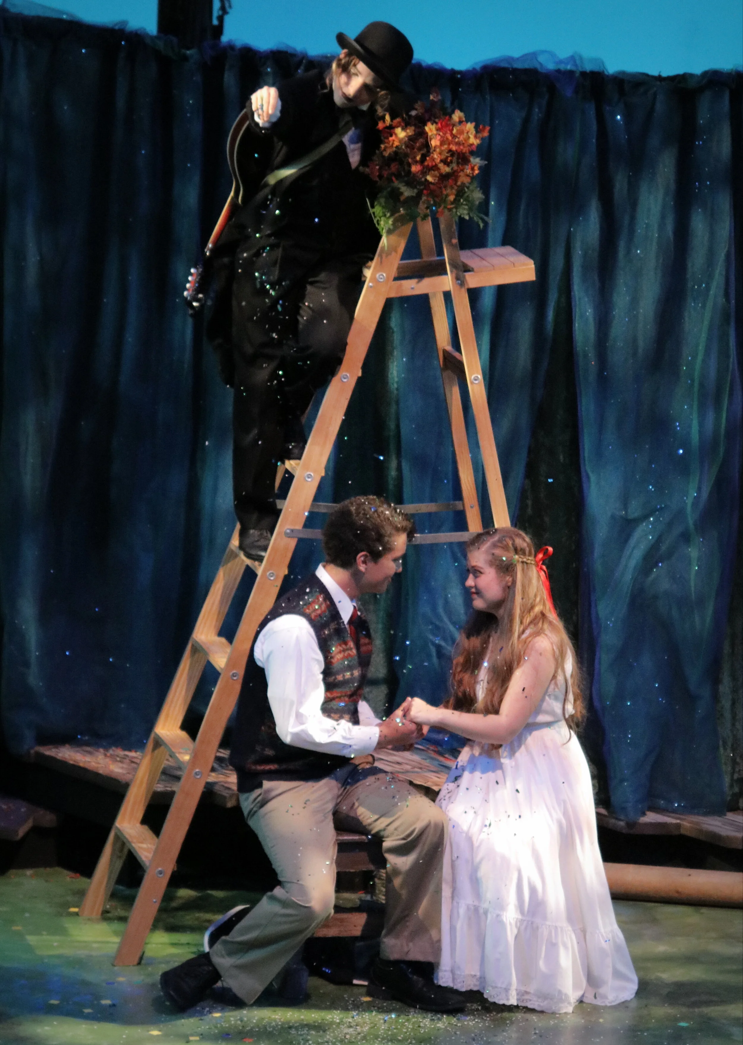 Sarah Horn as The Mute, Kevin Matsumoto as Matt, and MacKenna Wilson as Luisa in "The Fantasticks" at MPC Theatre Company. 