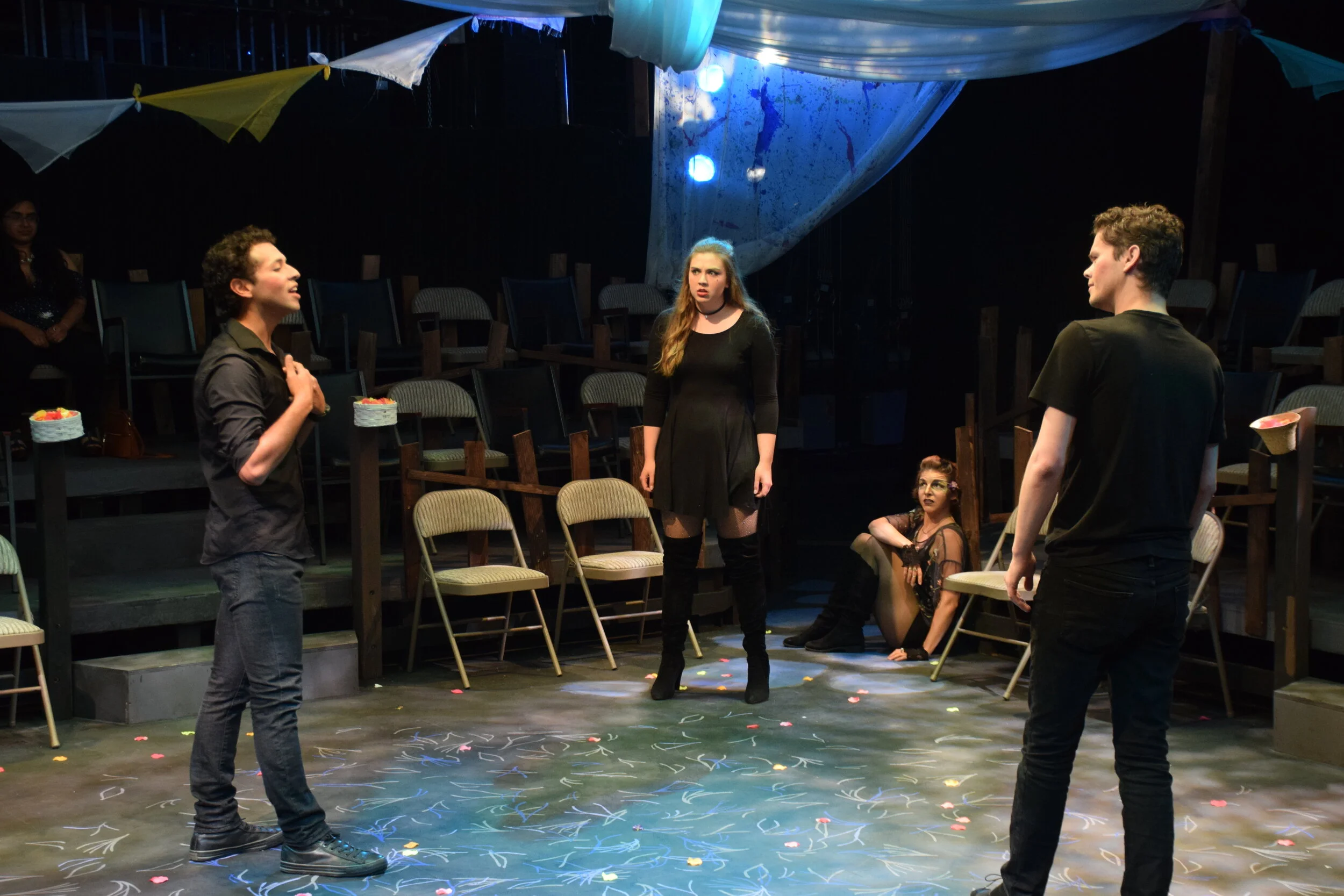 Roland Shorter as Lysander, Ashley Lyons as Helena, Sarah Horn as Puck, and Oliver Banham as Demetrius in "A Midsummer Night's Dream" at MPC Theatre Company. 