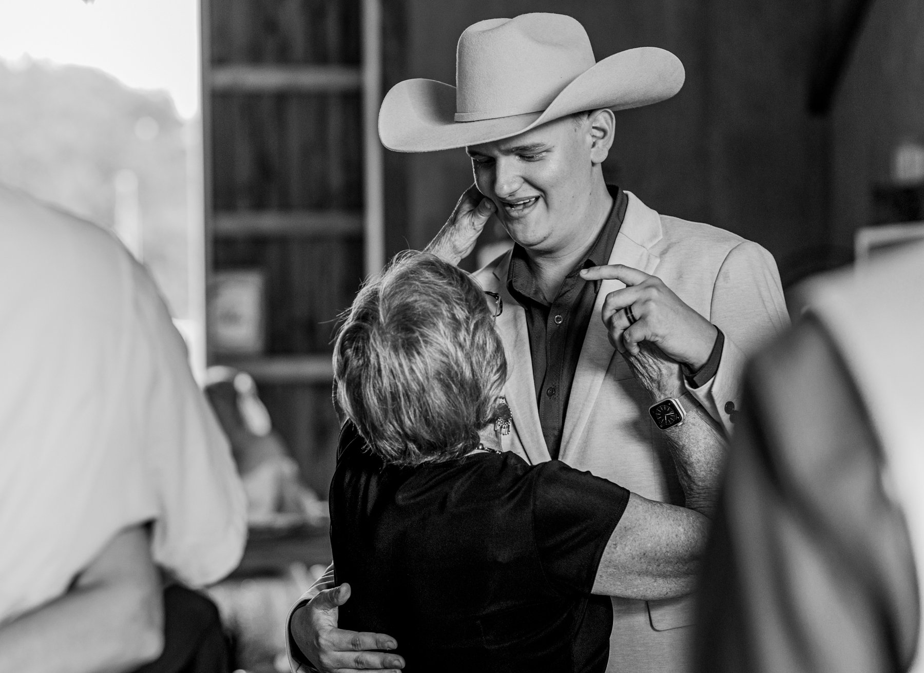 A guest dancing with Justyn pinches his cheek.