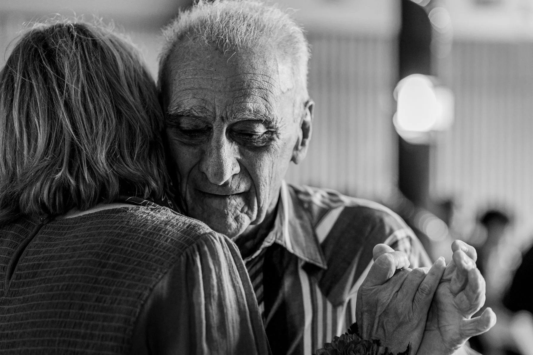 The DJ asked that any father and daughters wanting to dance to do so. Justyns grandfather dances with his daughter (Justyn's mother.)