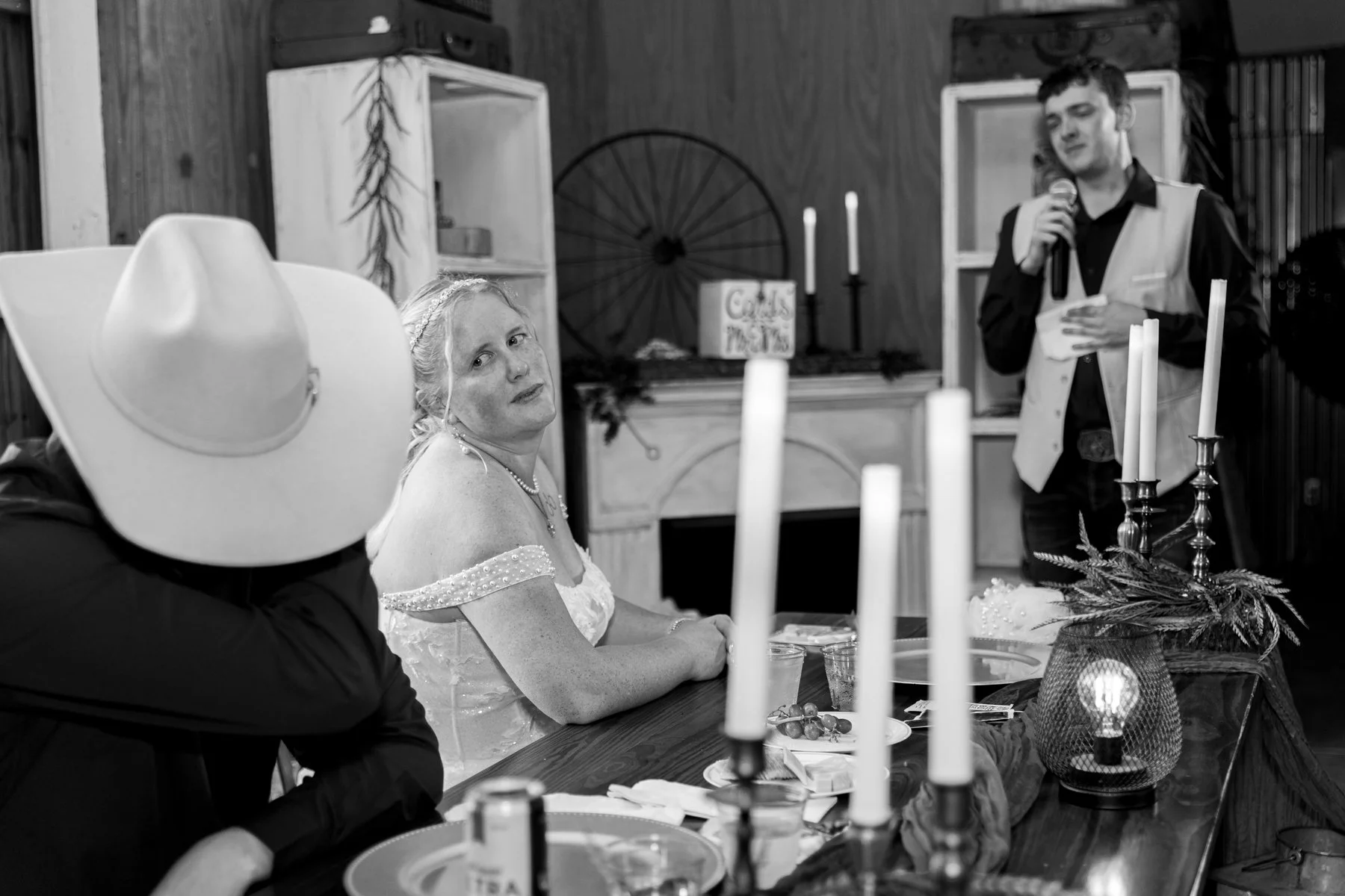 Maddie looks over at her emotional husband while the best man gives a teary speech.