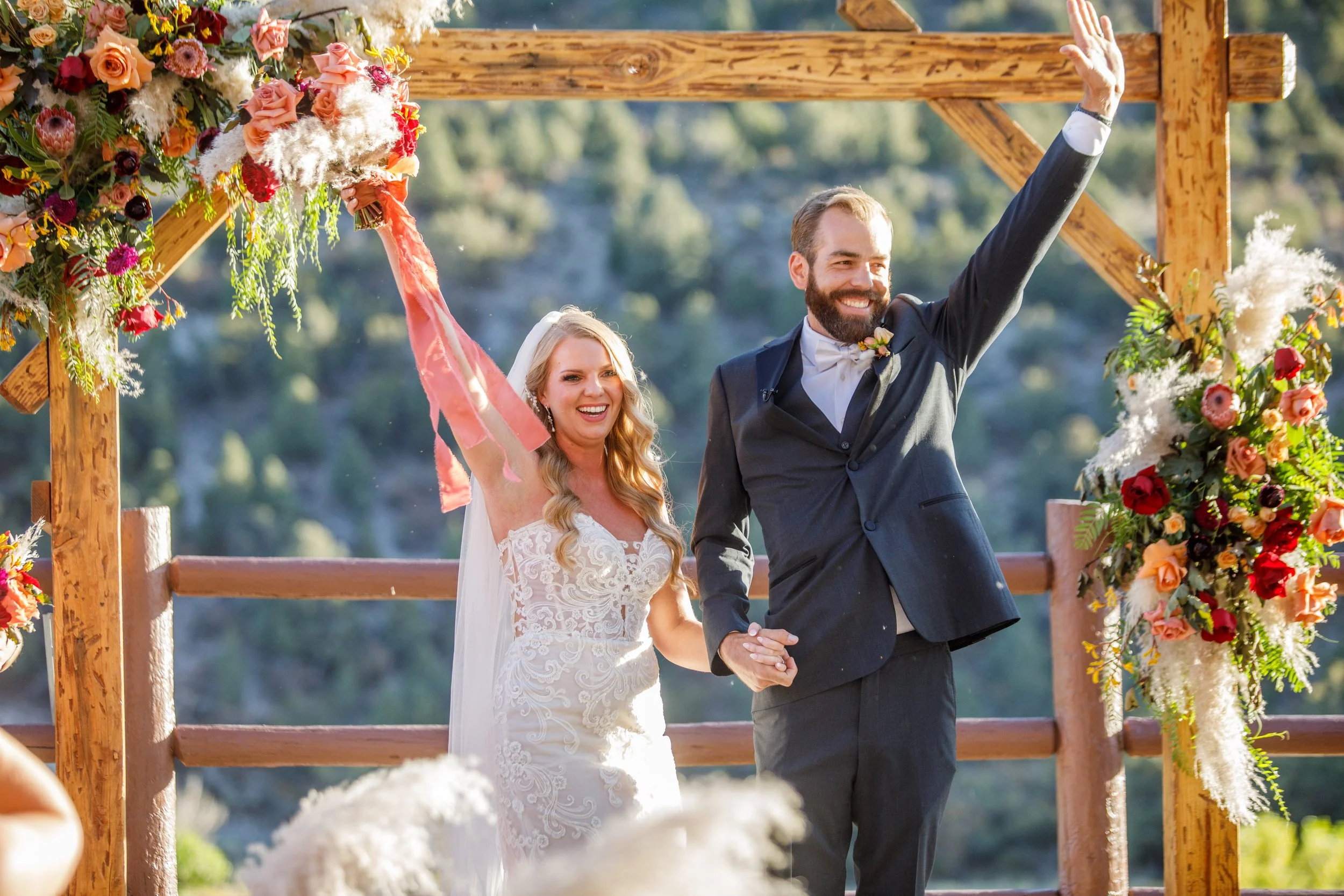 Wedding ceremony ends with bride and groom waving during end of ceremony at The Retreat on Charleston Peak