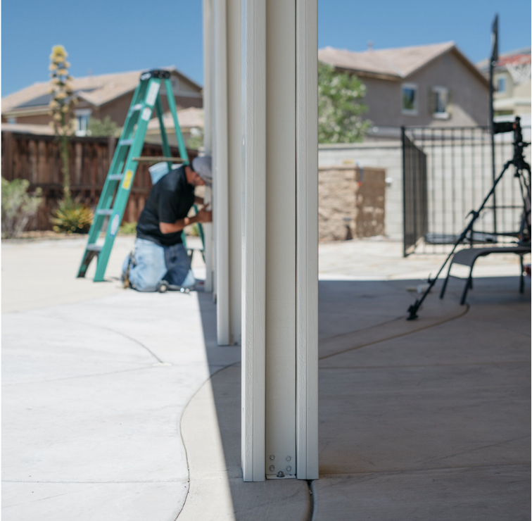 Patio cover beams being installed for a patio cover