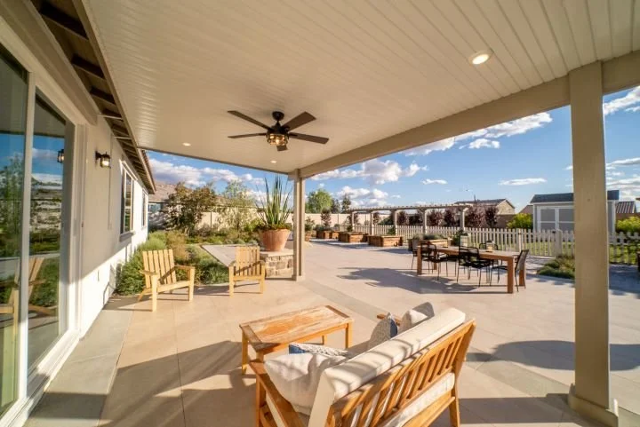 Alumawood Patio with ceiling fan in a large backyard