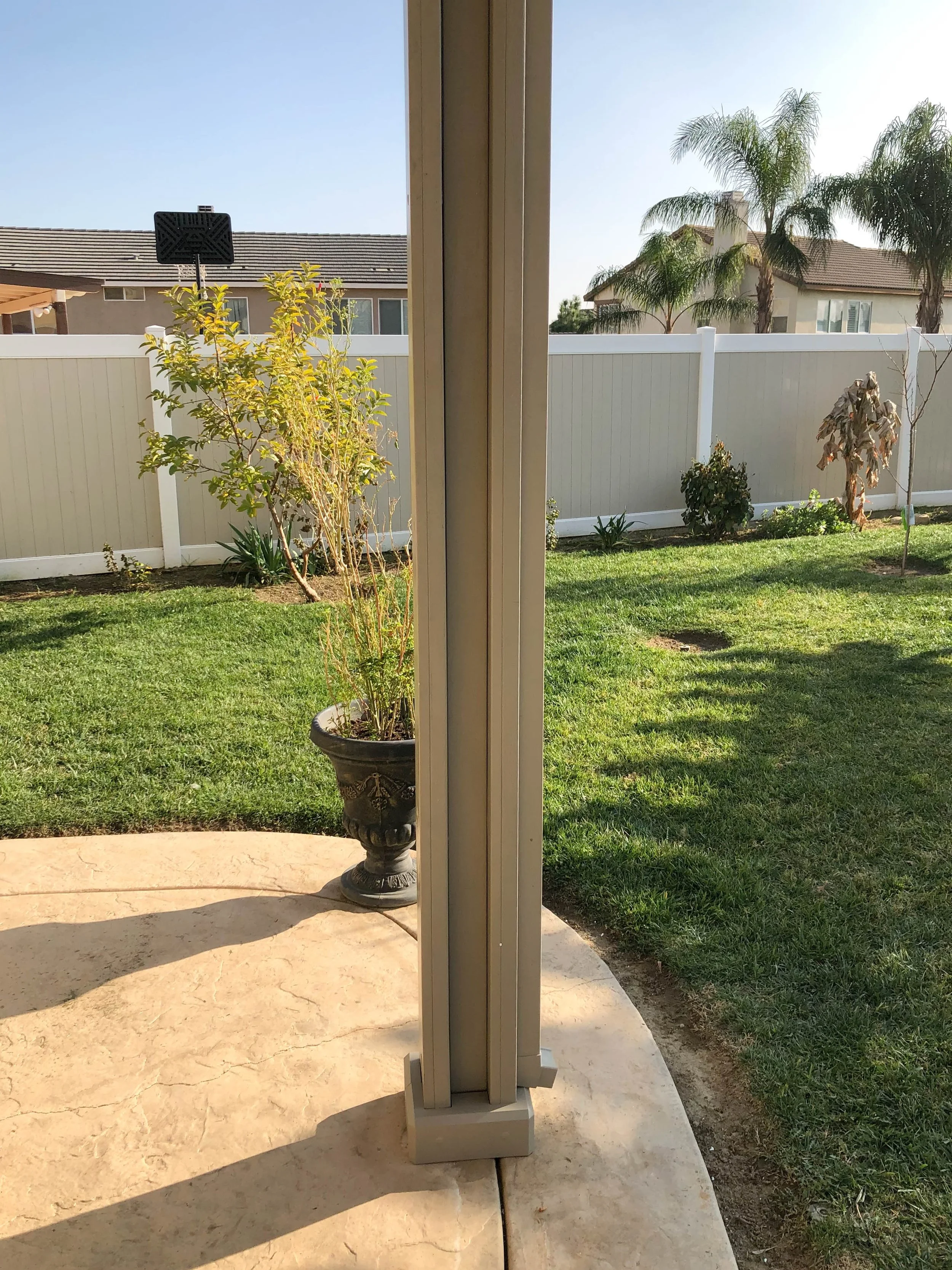 Patio cover post after AlumaBase is installed at the bottom for a cleaner look